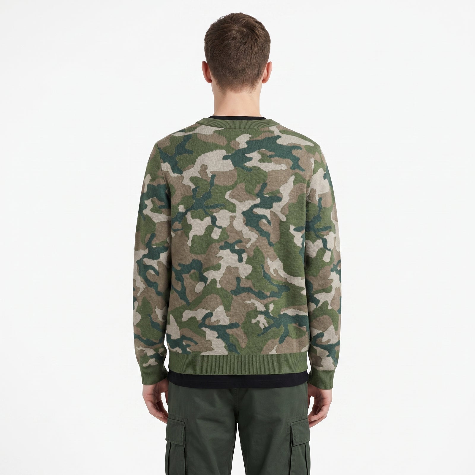Person wearing a camouflage sweater on a white background
