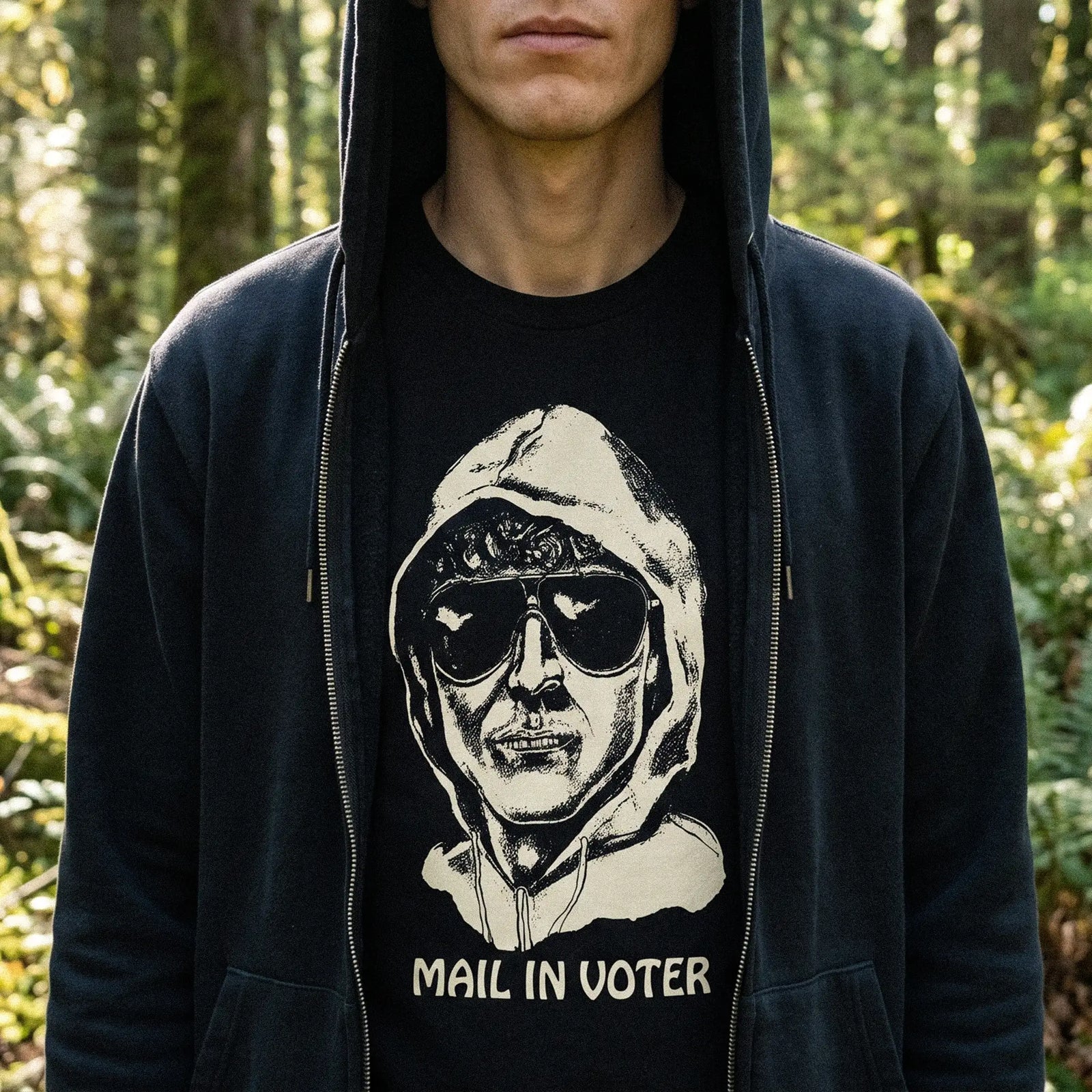 Man wearing the Mail-In Voter Unabomber T-Shirt outdoors