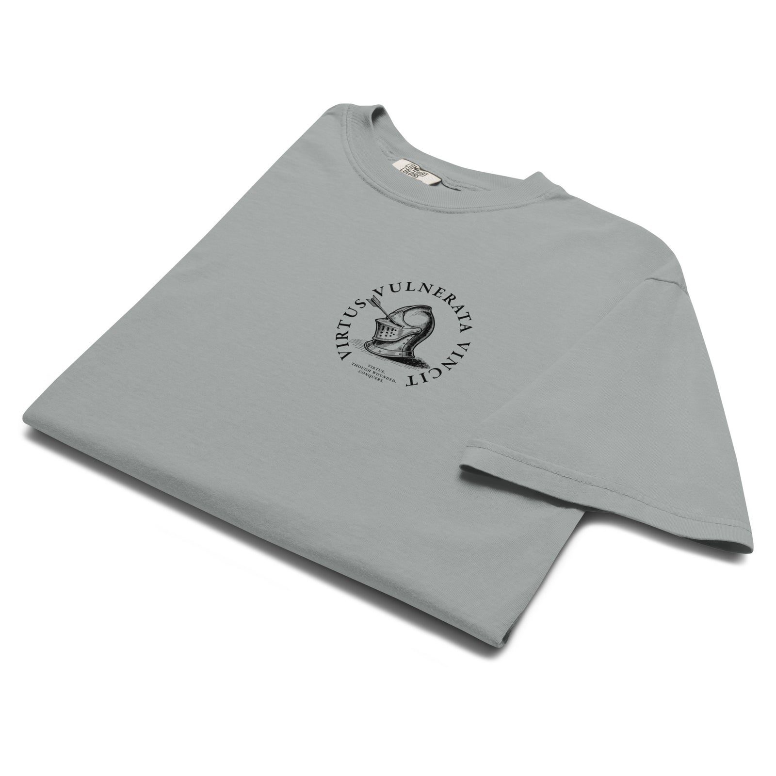 Minimalist graphic t-shirt featuring an illustrated medieval knight pierced by arrows with the Latin phrase Virtus Vulnerata Vincit (“Virtue, though wounded, conquers”).