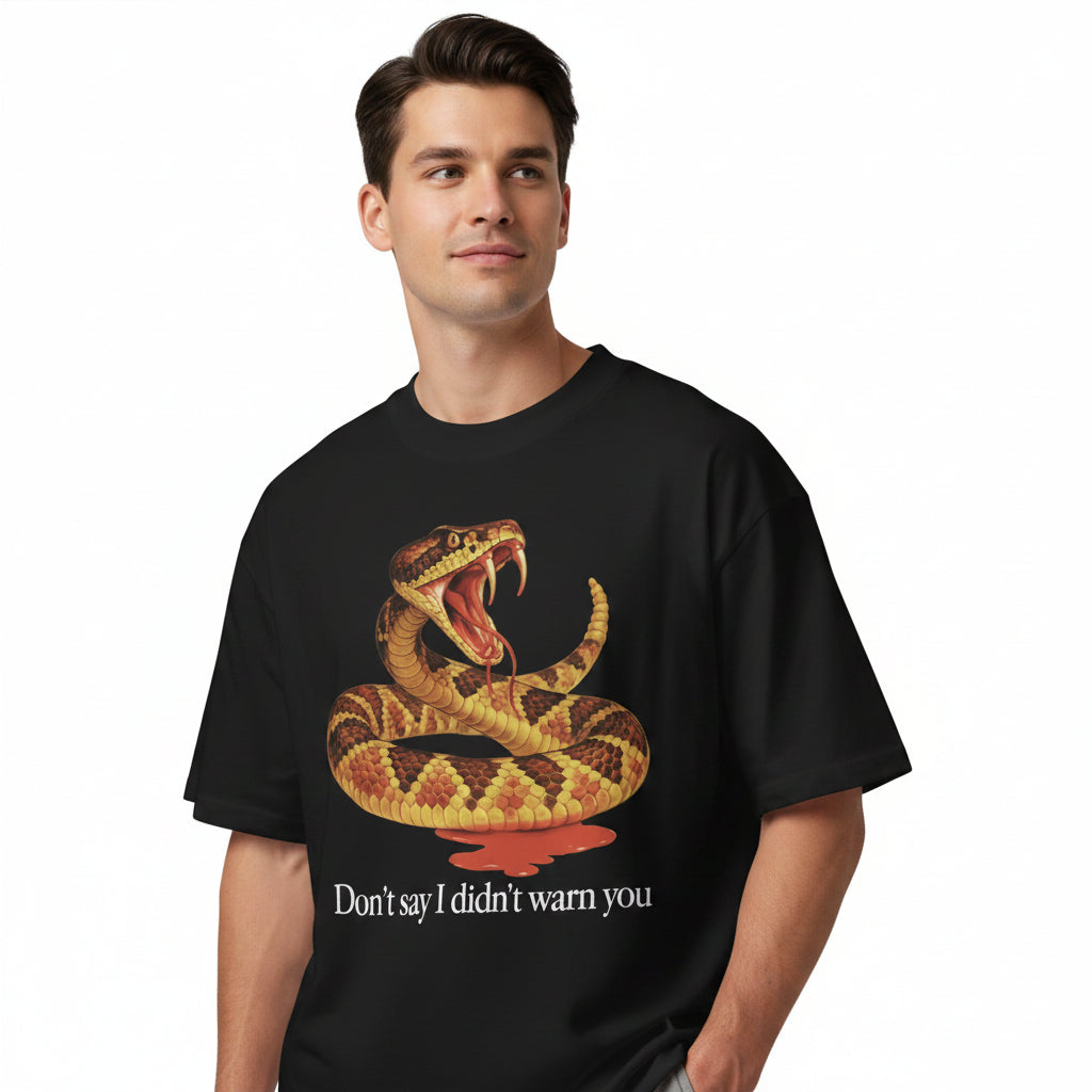 Person wearing a black t-shirt with a snake graphic and text on a white background