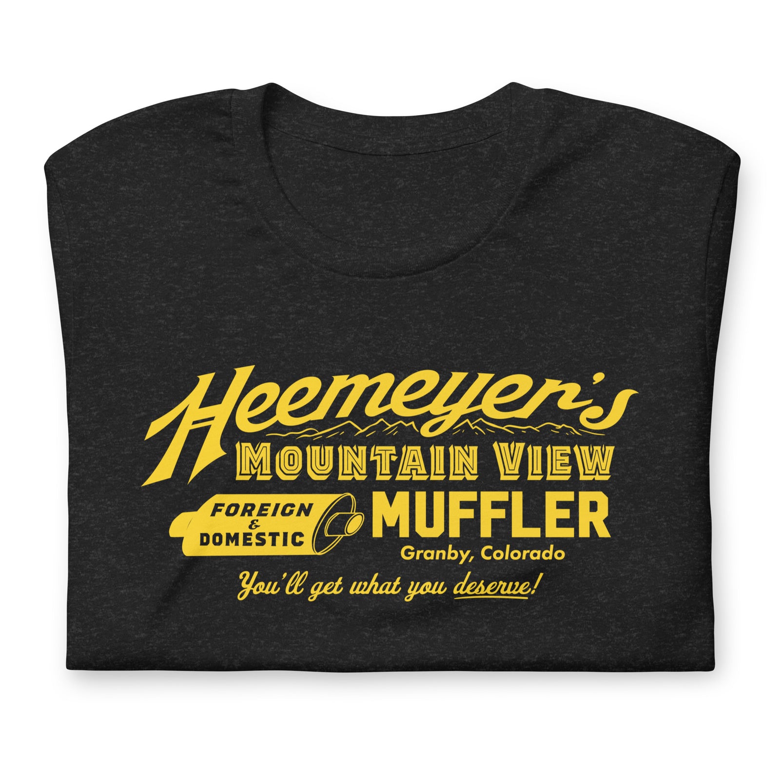 Heemeyer's Mountain View Muffler t-shirt by Liberty Maniacs laying flat and folded on a white background.