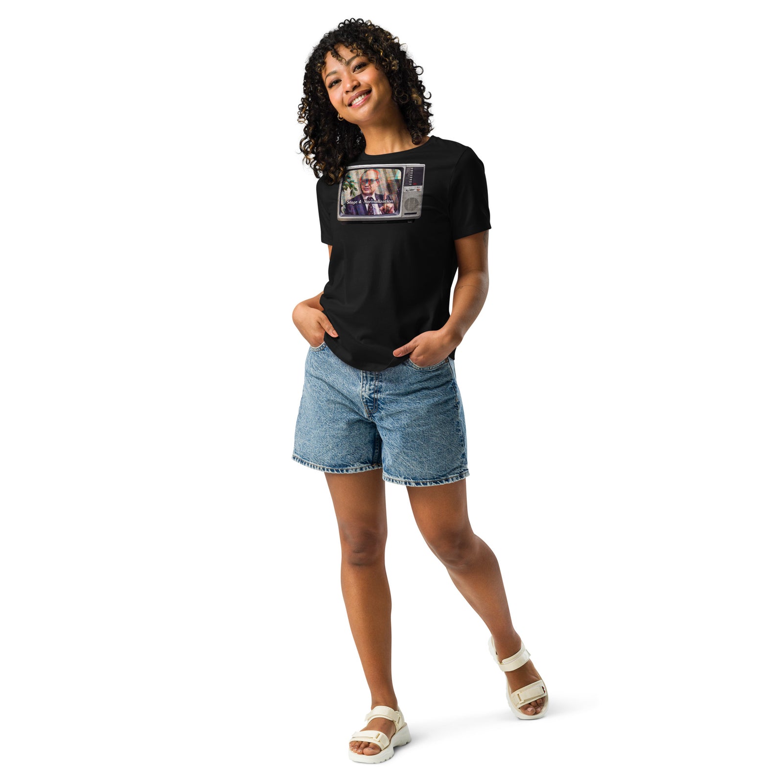 Full-length view of woman wearing black Yuri Bezmenov graphic tee and denim shorts