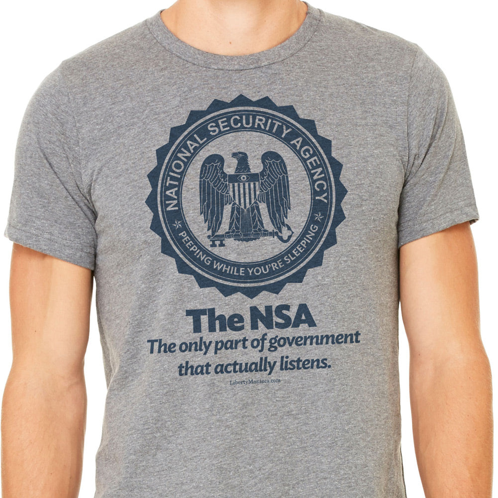 A gray crew neck t-shirt with the text 'The NSA The only part of government that actually listens.' printed on the front.