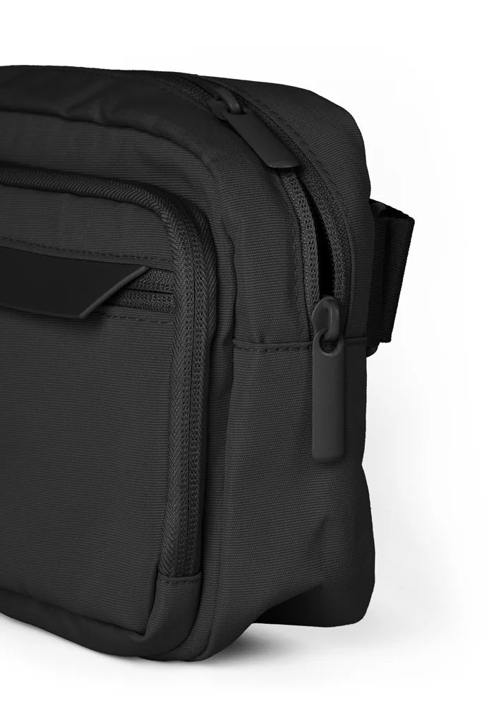 Black bag with a strap on a white background