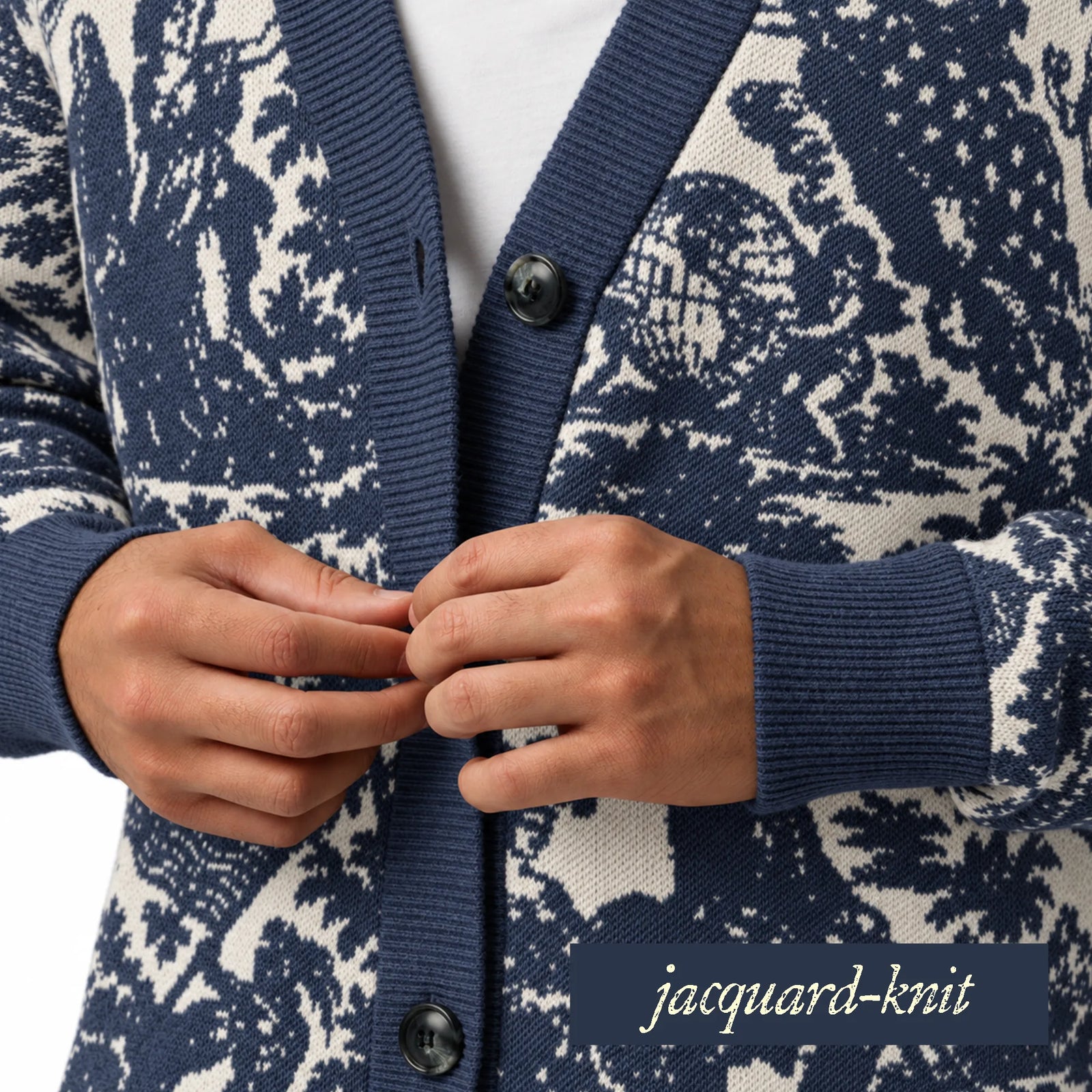 A close-up of a person wearing a navy and off-white jacquard-knit cardigan with dark buttons, with their hands fastening the front. A text label in the bottom right corner reads 'jacquard-knit'.