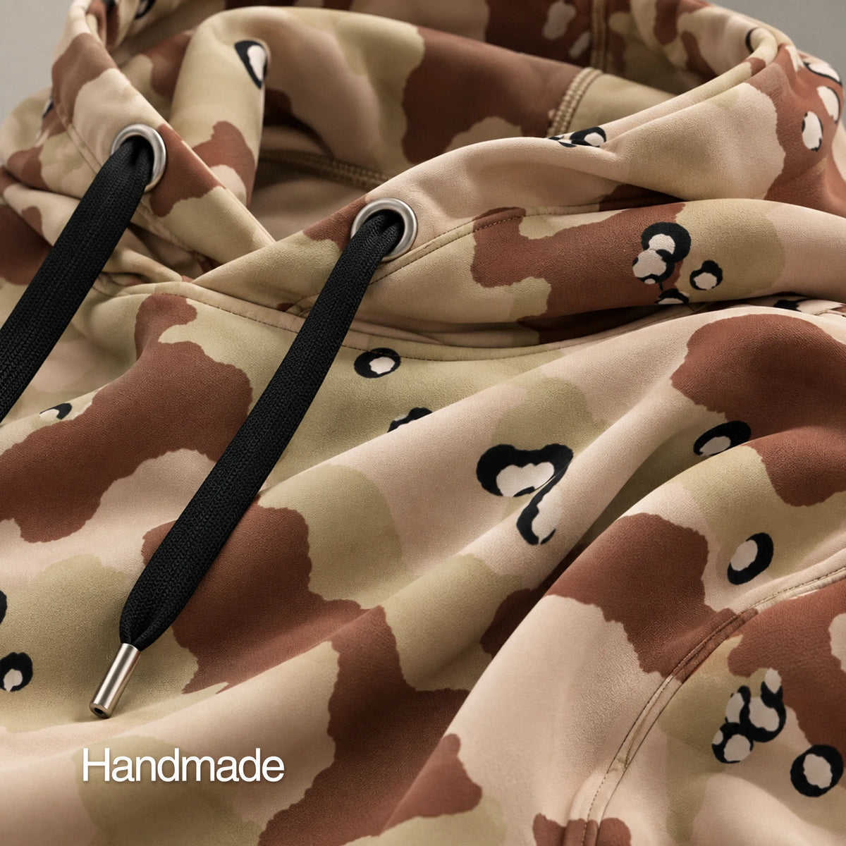 Heavyweight six-color desert camo hoodie detail showing smooth sublimated fabric and construction
