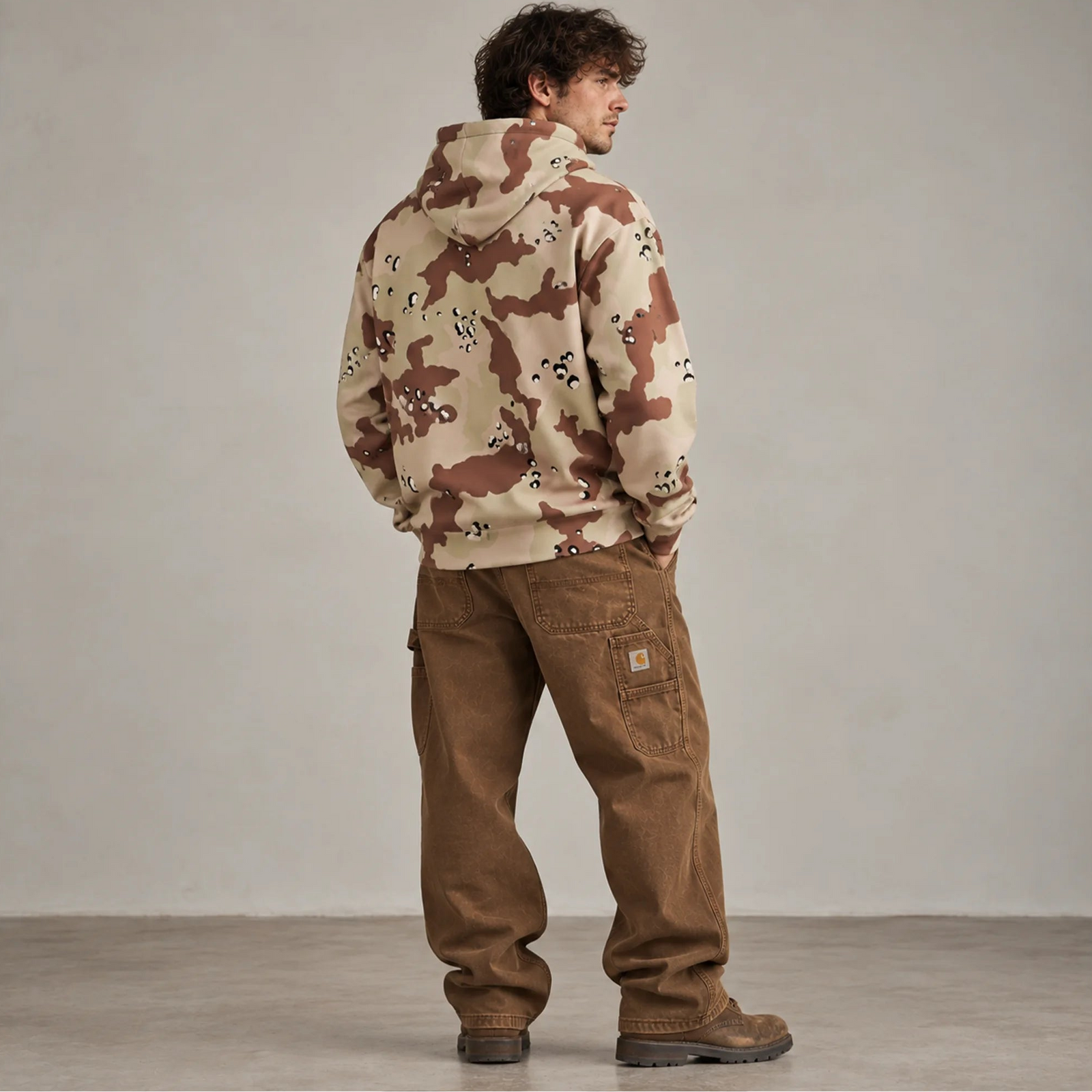 Six-color desert camo hoodie back view on male model with brown workwear pants