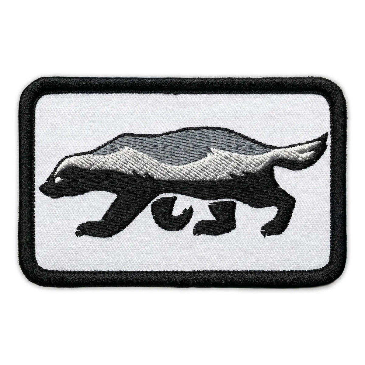 Embroidered patch of a honey badger on a white background