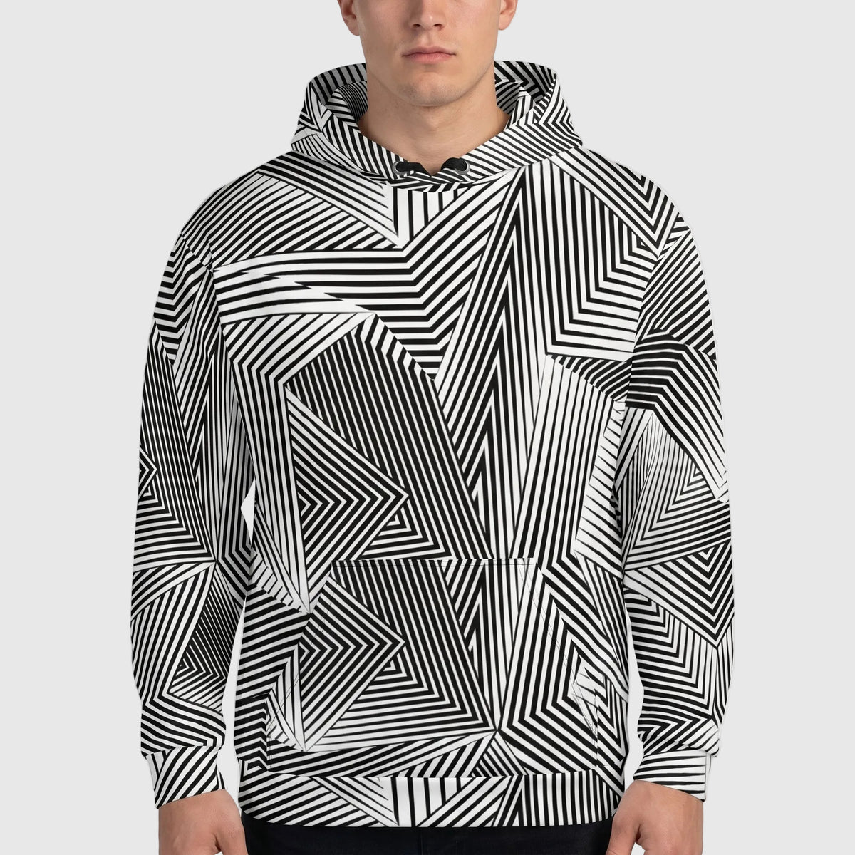 Person wearing a black and white geometric patterned hoodie against a plain background
