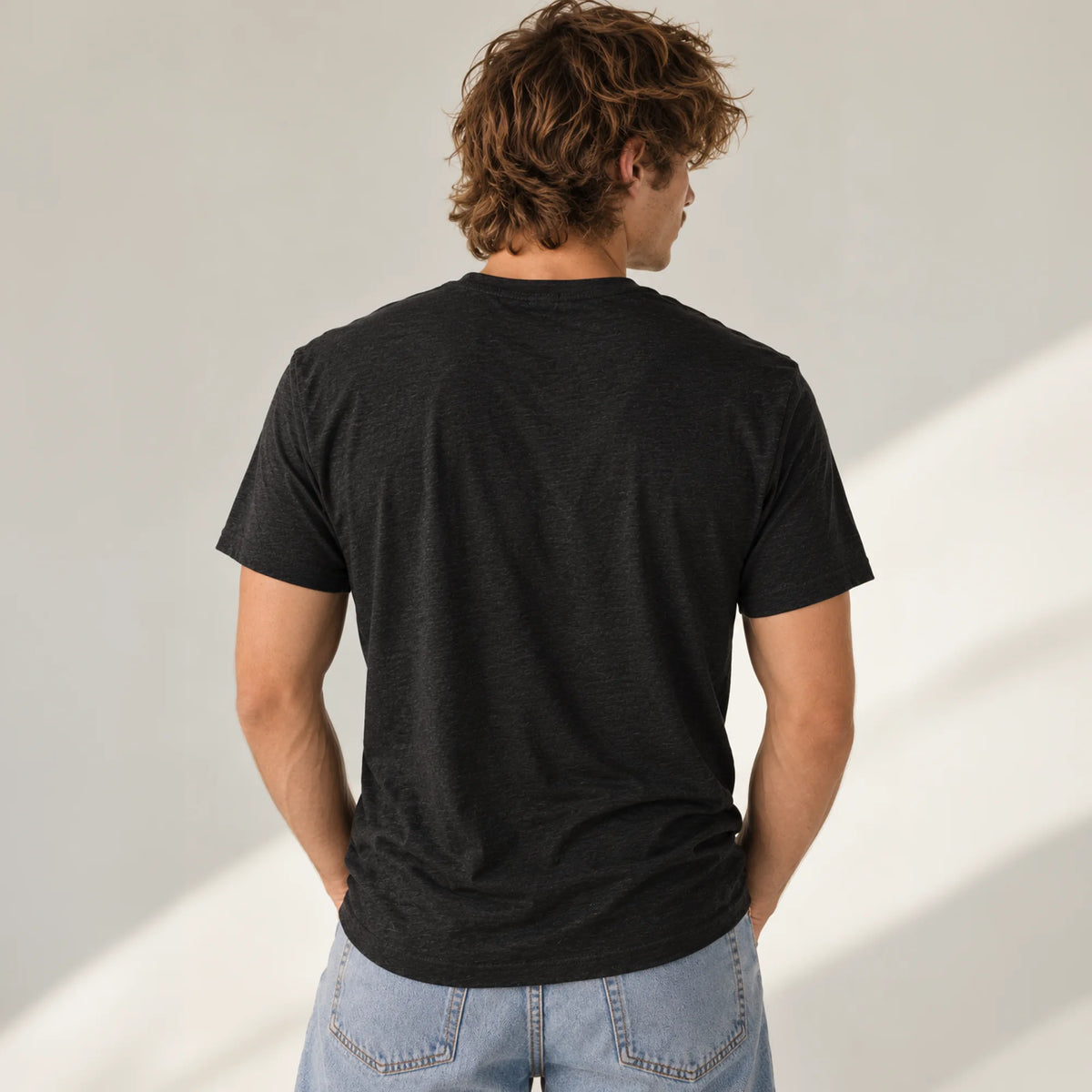 Political Advisory black tri-blend T-shirt back view