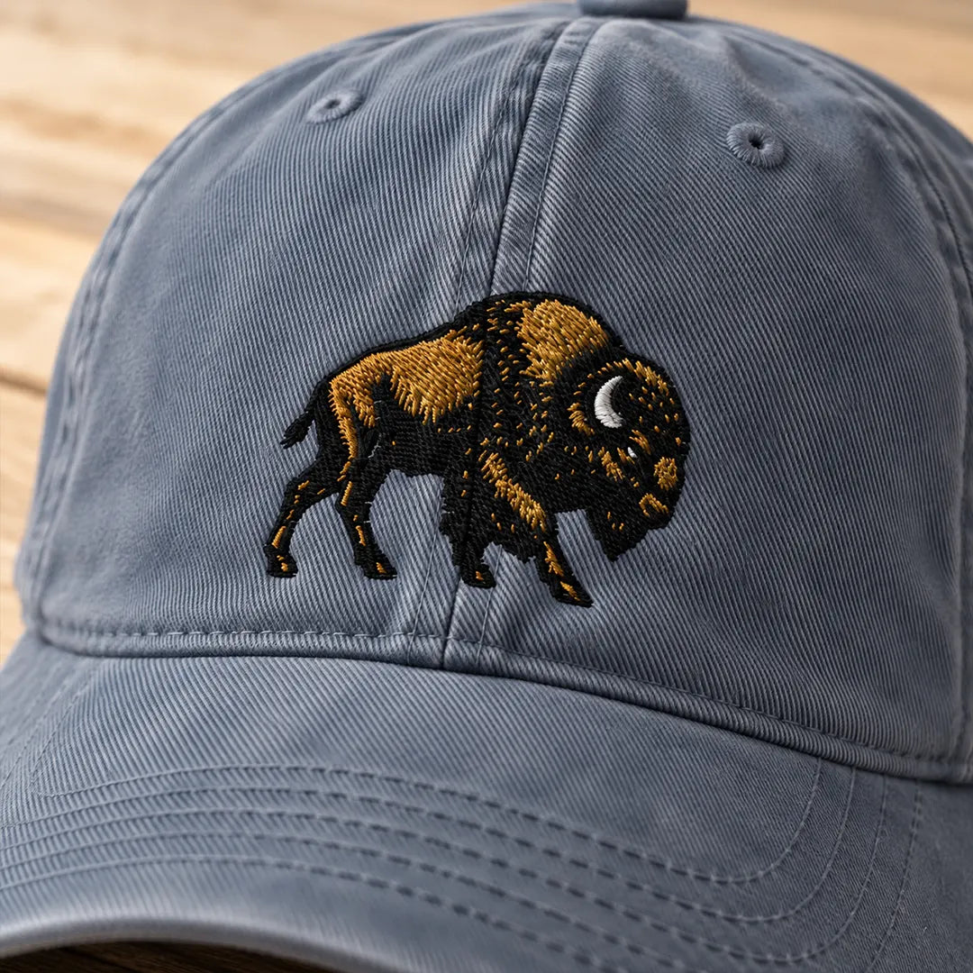 Bison sunwashed cotton cap in Denim, front view showing black and gold-brown bison embroidery