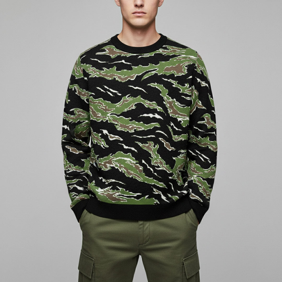 A man wearing a tiger stripe jungle camouflage knit sweater by Liberty Maniacs
