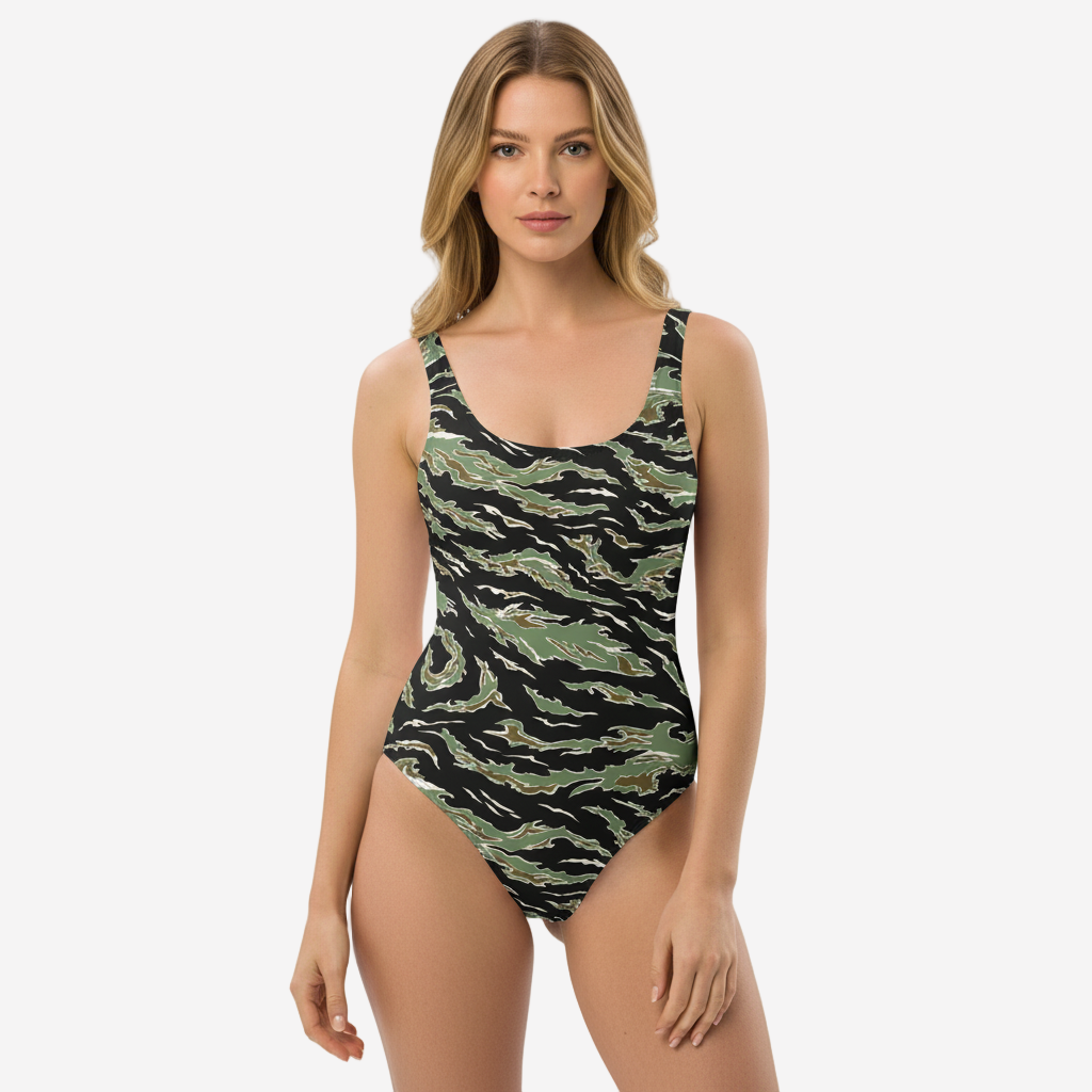 Woman wearing a camouflage-patterned swimsuit on a white background