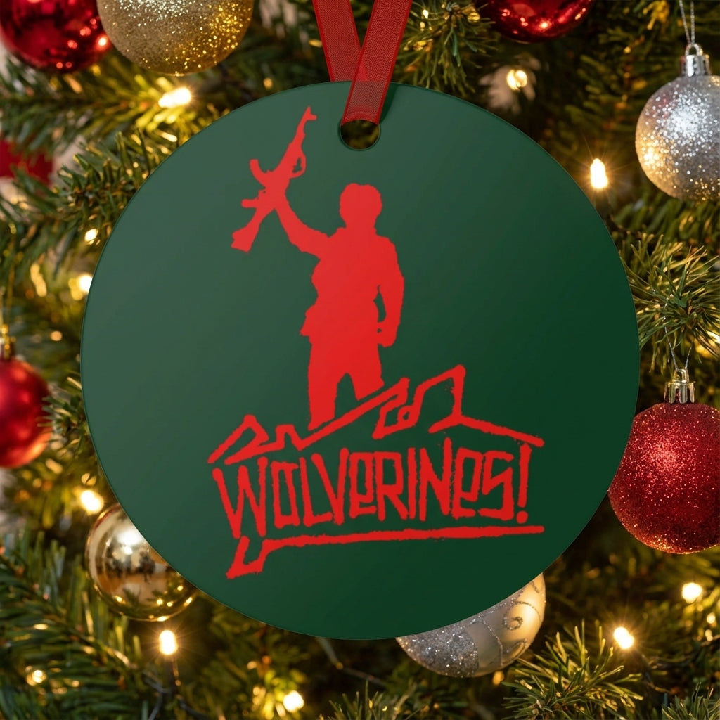 Green ornament with red &#39;Wolverines!&#39; design on a Christmas tree.