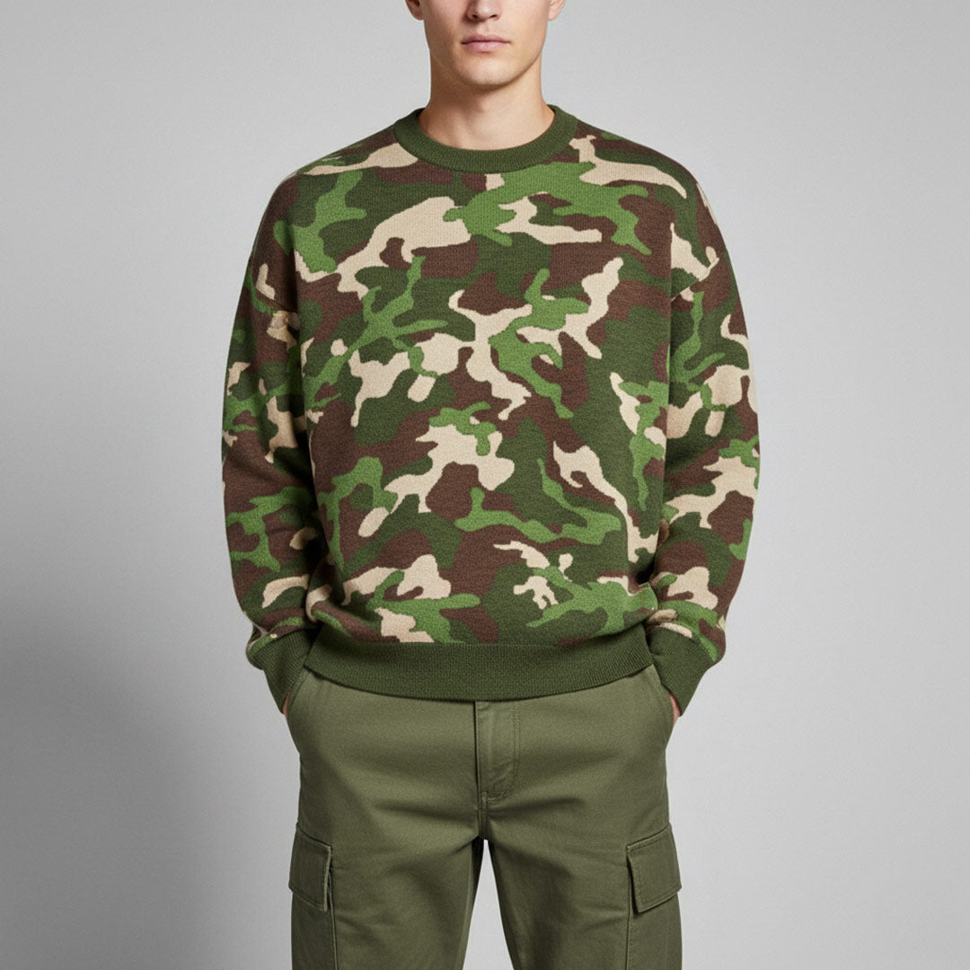 Man wearing the Liberty Maniacs Woodland Knit Field Sweater front view in green, brown, and tan camo