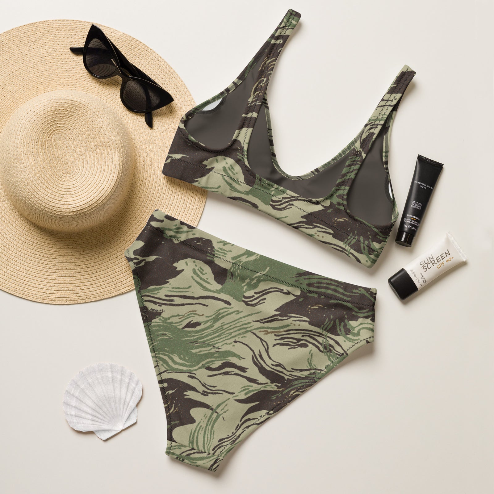 Back of the Rhodesian Brushstroke camouflage bikini displayed with beach accessories