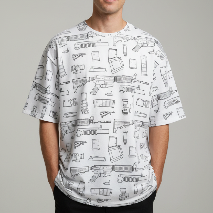 Person wearing a white t-shirt with black gun pattern on a gray background