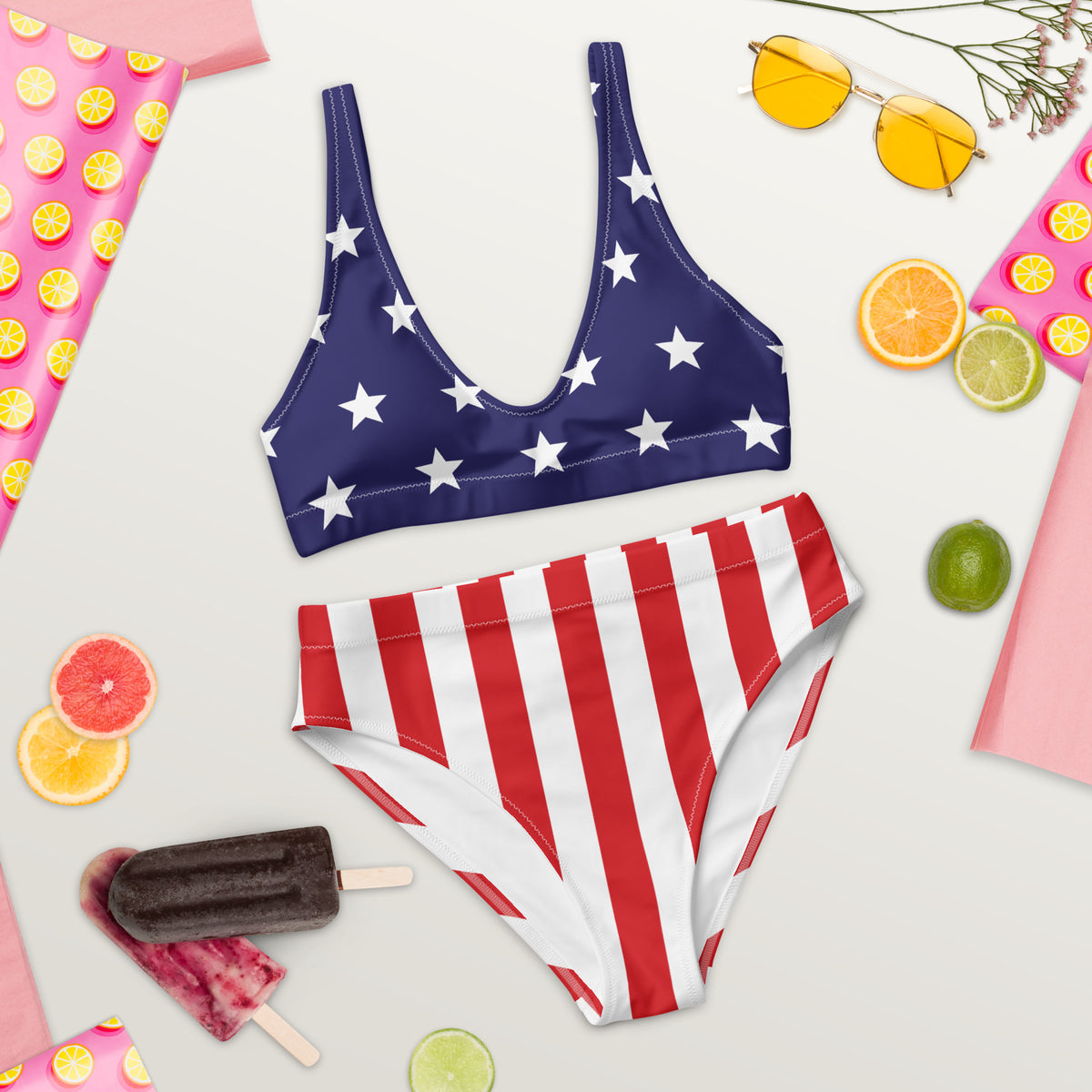 American flag-themed bikini set with accessories on a light background