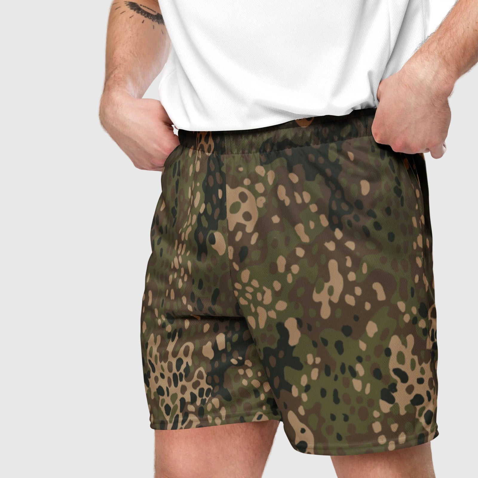 Man wearing Erbsenmuster Pea Dot Field Green camo mesh shorts