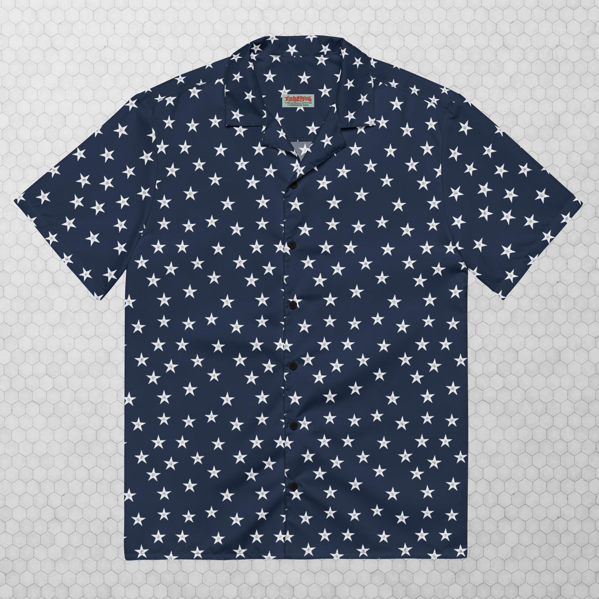 A navy button-up shirt with a pattern of white stars spread evenly across the fabric.