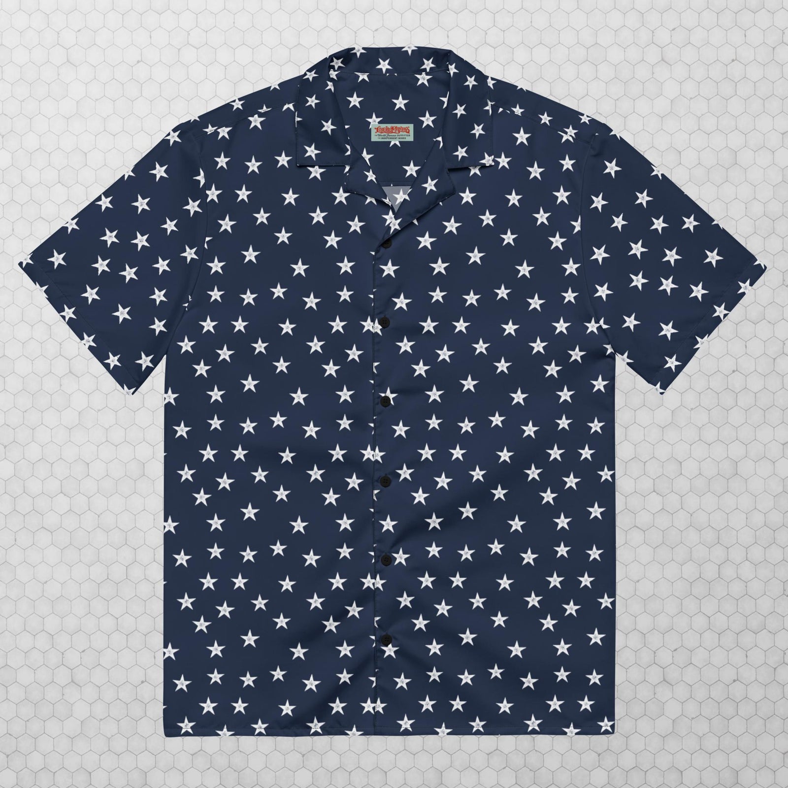 A navy button-up shirt with a pattern of white stars spread evenly across the fabric.
