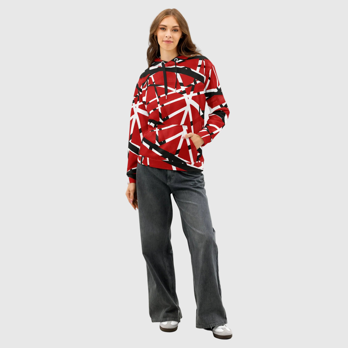 Woman wearing a red and black patterned Frankenstripes Cotton Hoodie with gray pants on a white background
