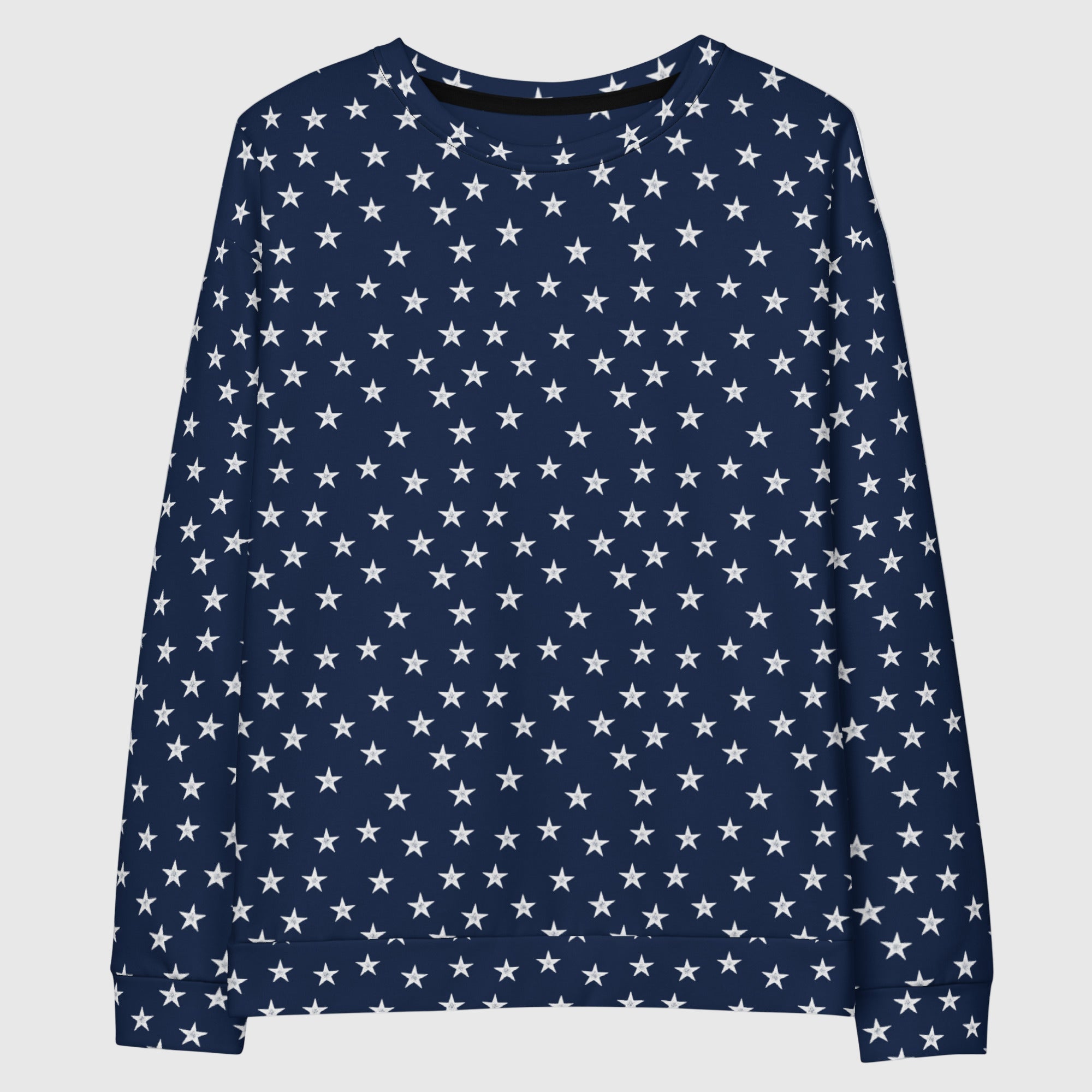 Woman wearing a navy blue sweater with white star pattern on a gray background