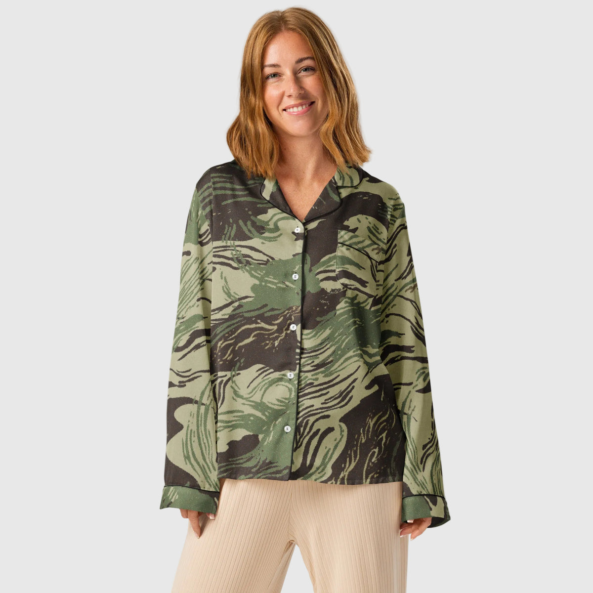 Woman wearing a Rhodesian Brushstroke camouflage long-sleeve pajama top