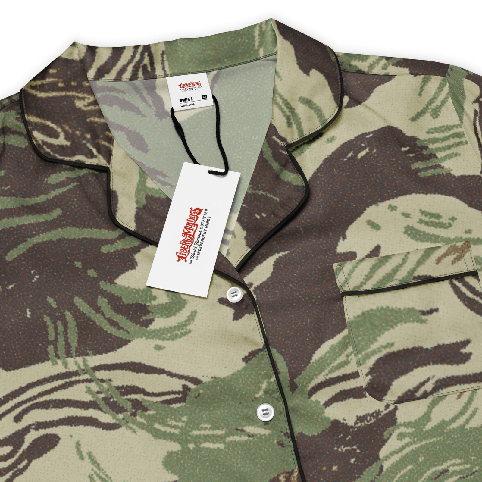 Close detail of Rhodesian Brushstroke pajama top, black piping and buttons