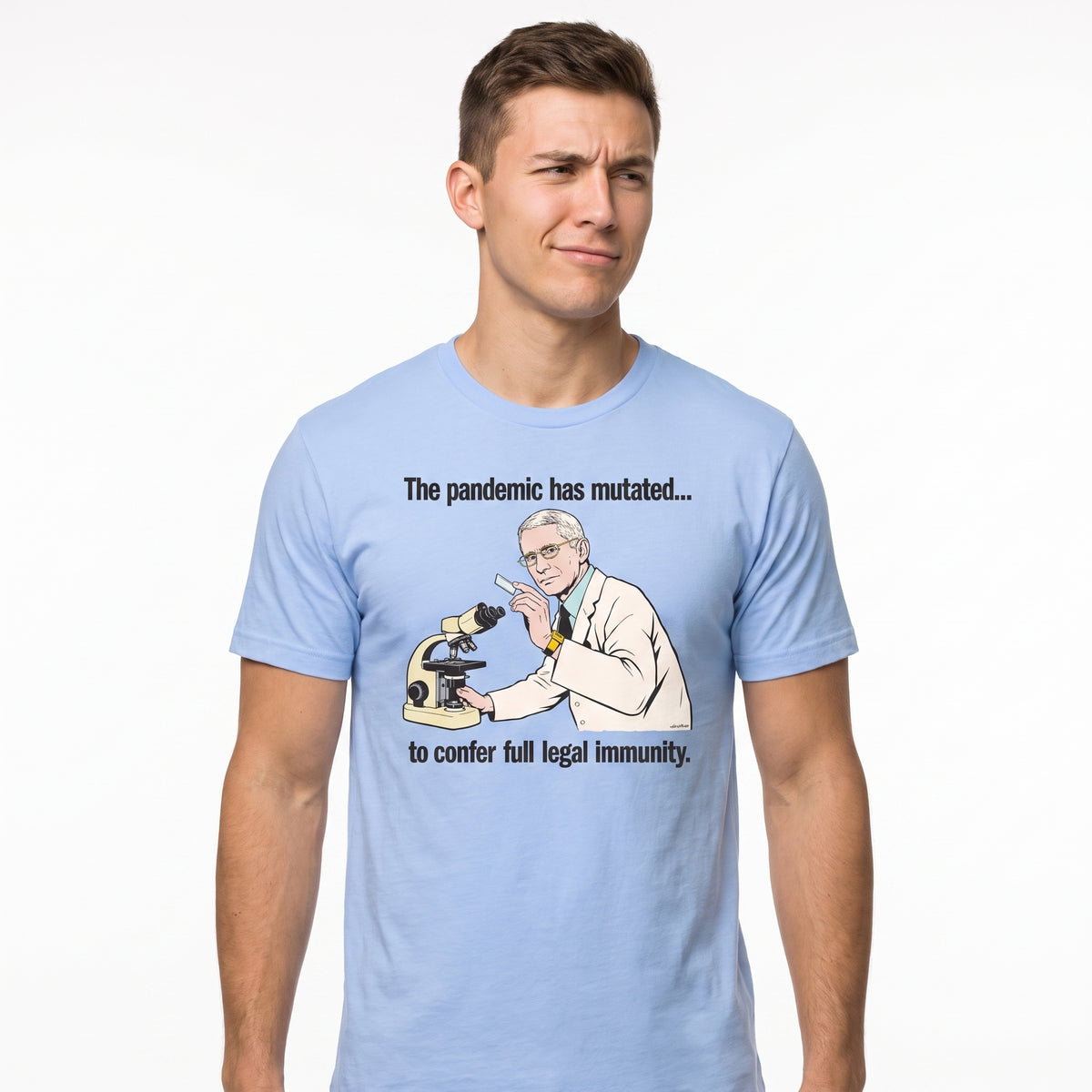 A man wearing a light blue graphic t-shirt with a cartoon illustration of a scientist looking at a microscope and the text 'The pandemic has mutated.