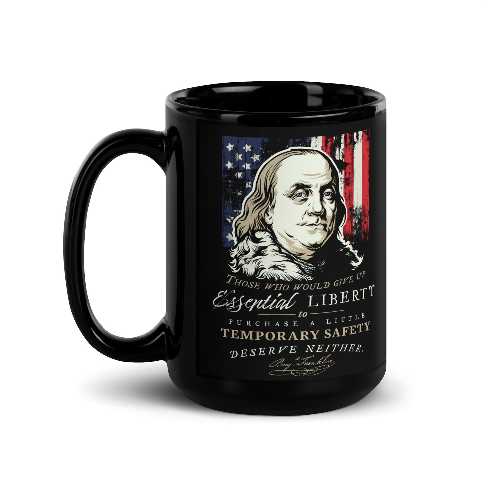 A black ceramic mug featuring a graphic print of Benjamin Franklin, an American flag, and a quote about liberty and safety, shown on a plain white background.