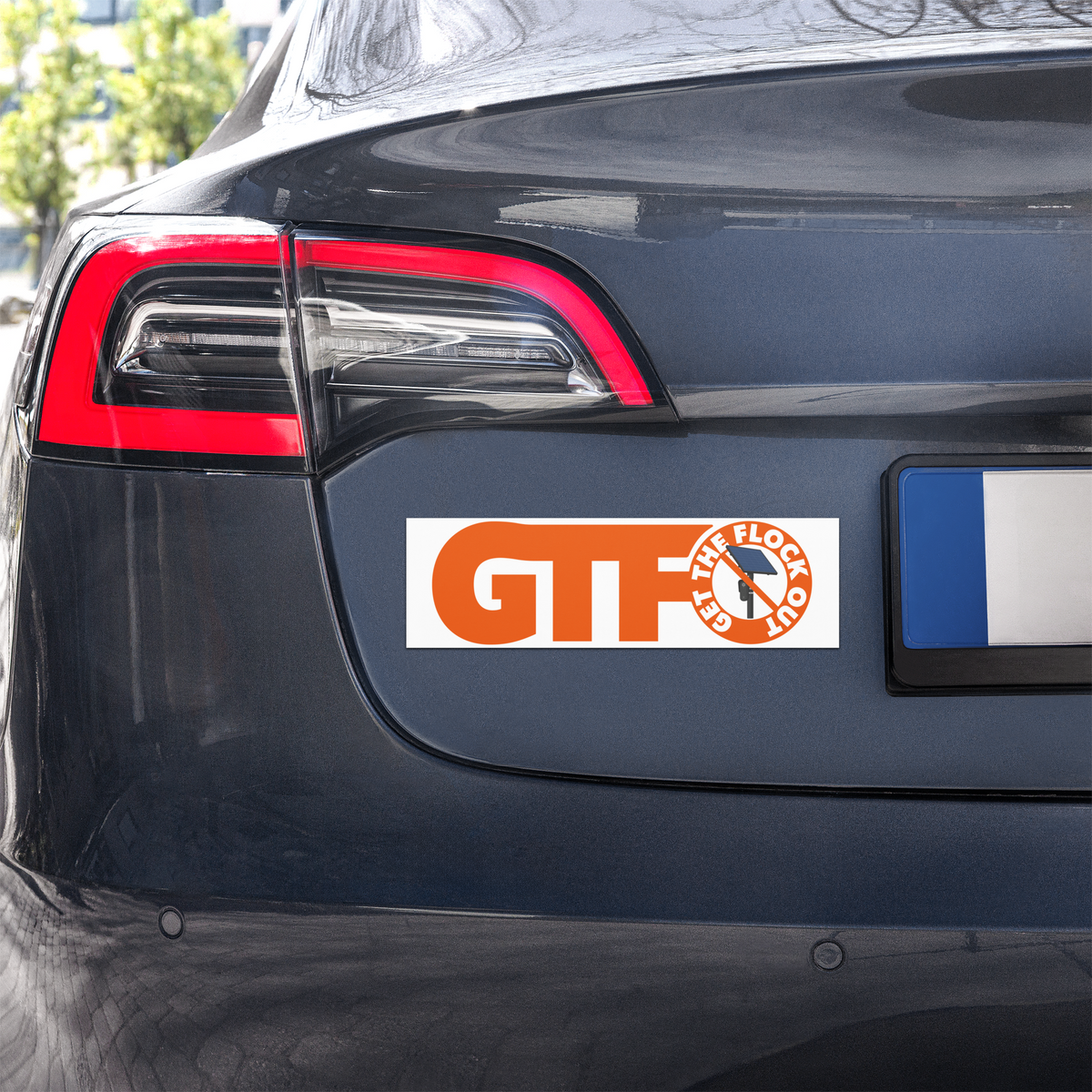 Get the Flock Out anti-surveillance car magnet with crossed-out Flock camera graphic