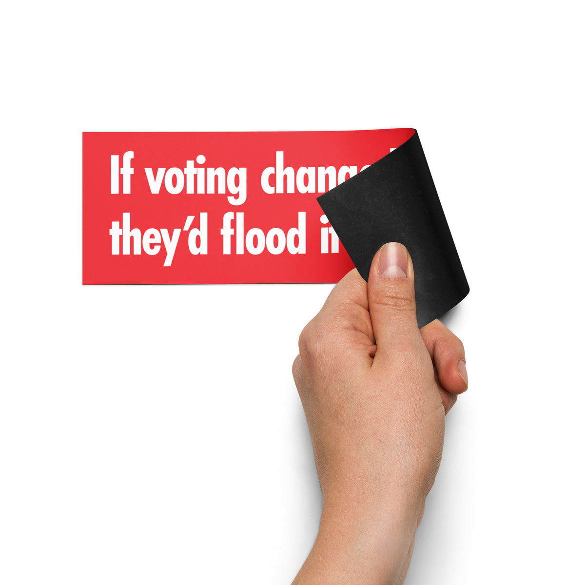 Magnet that states "If voting changed anything, they'd flood it with illegals." being placed by a hand on a white background.