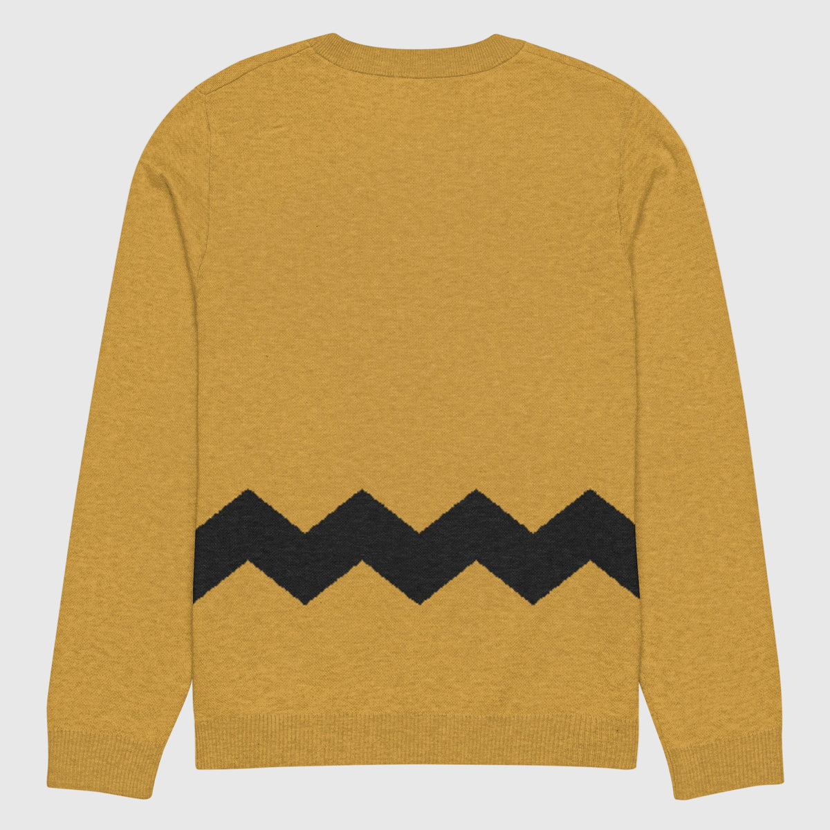 The back view of a Liberty Maniacs Charlie Brown inspired sweater with black zigzag pattern laying flat