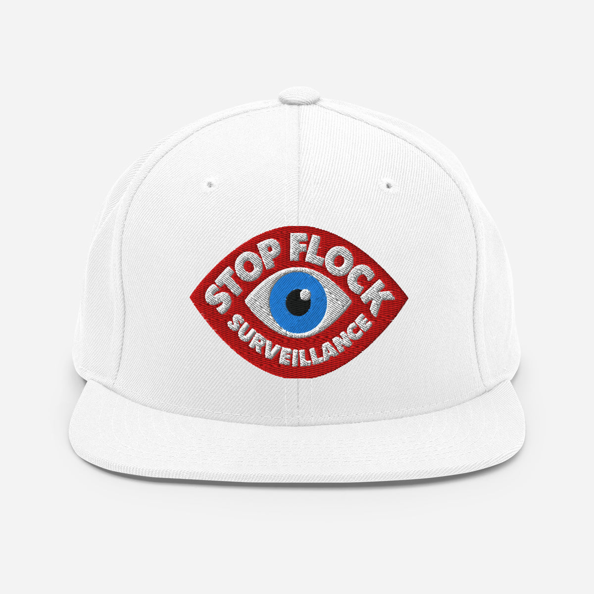A white structured baseball cap with a flat brim, featuring a red embroidered patch on the front with a blue eye graphic and the words 'STOP FLOCK SURVEILLANCE'.