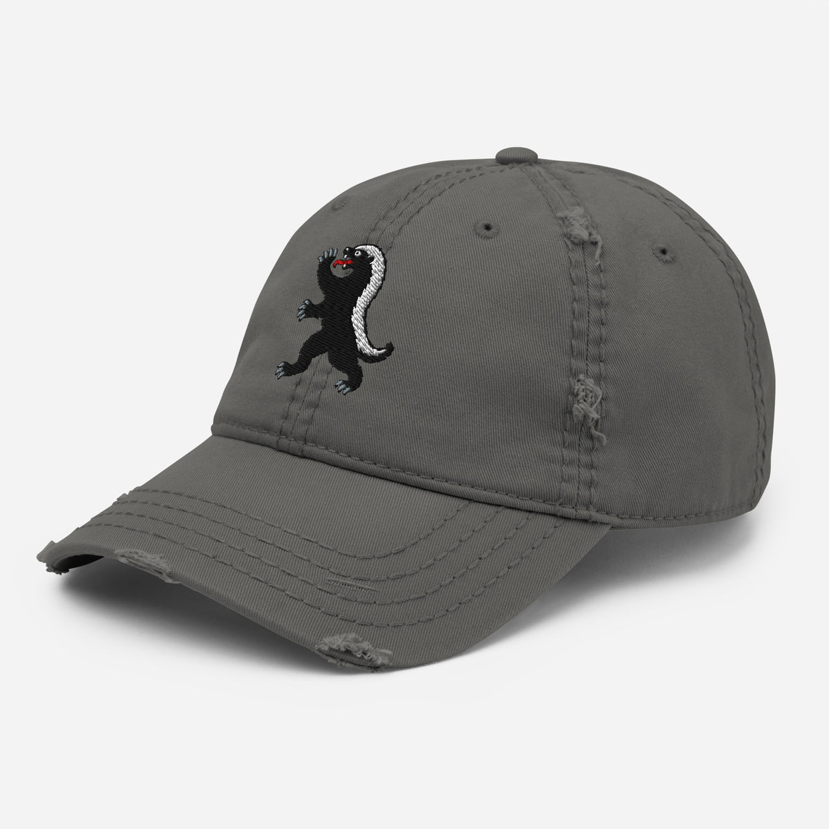 Charcoal Grey heraldic honey badger dad hat, three-quarter view showing front embroidery and distressed crown seams