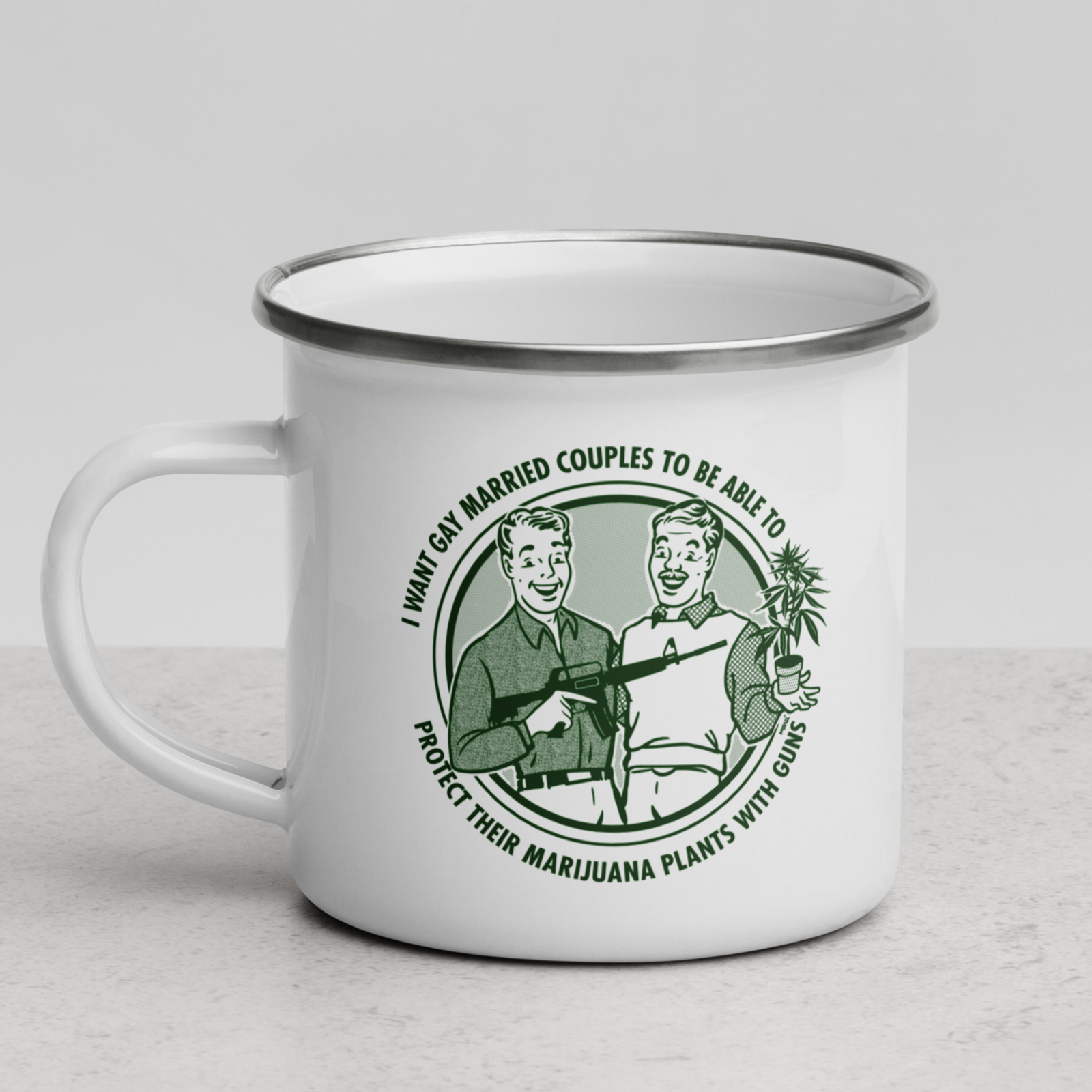 A white enamel-style mug with a silver metal rim and handle, featuring a green vintage-style circular graphic of two men and the text 'I WANT MY MARRIED COUPLES TO BE ABLE TO PROTECT THEIR MARIJUANA PLANTS WITH GUNS.' The mug is photographed on a light gray surface against a neutral light gray background.