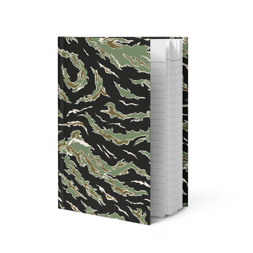 Notebook with green tiger stripe pattern on a black background