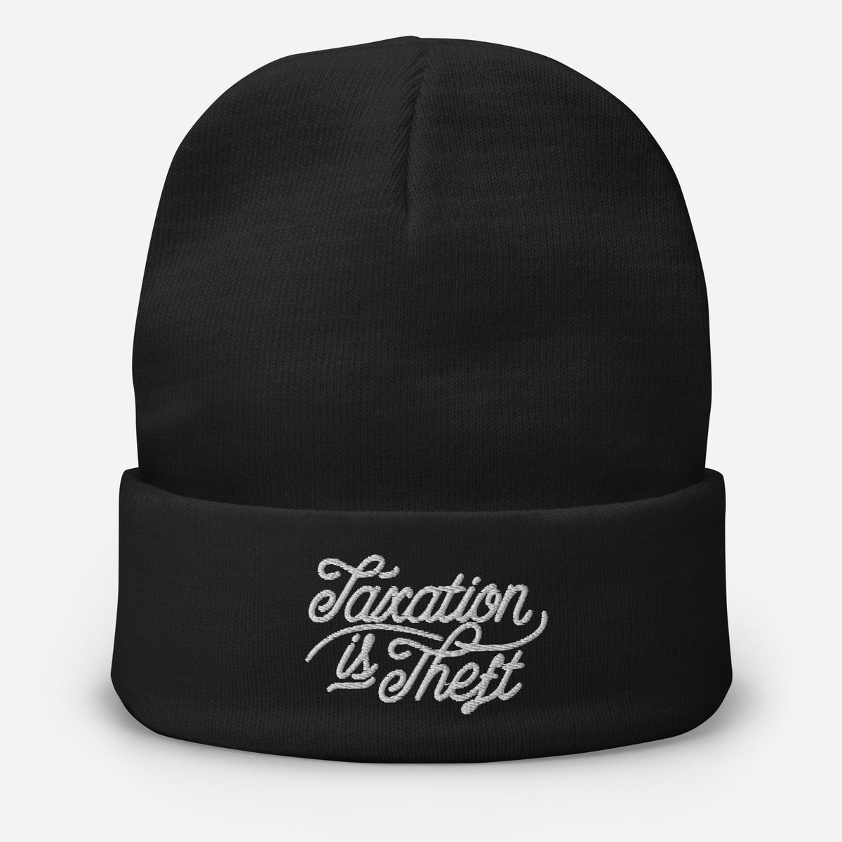 Black Taxation Is Theft knit beanie showing embroidered front lettering