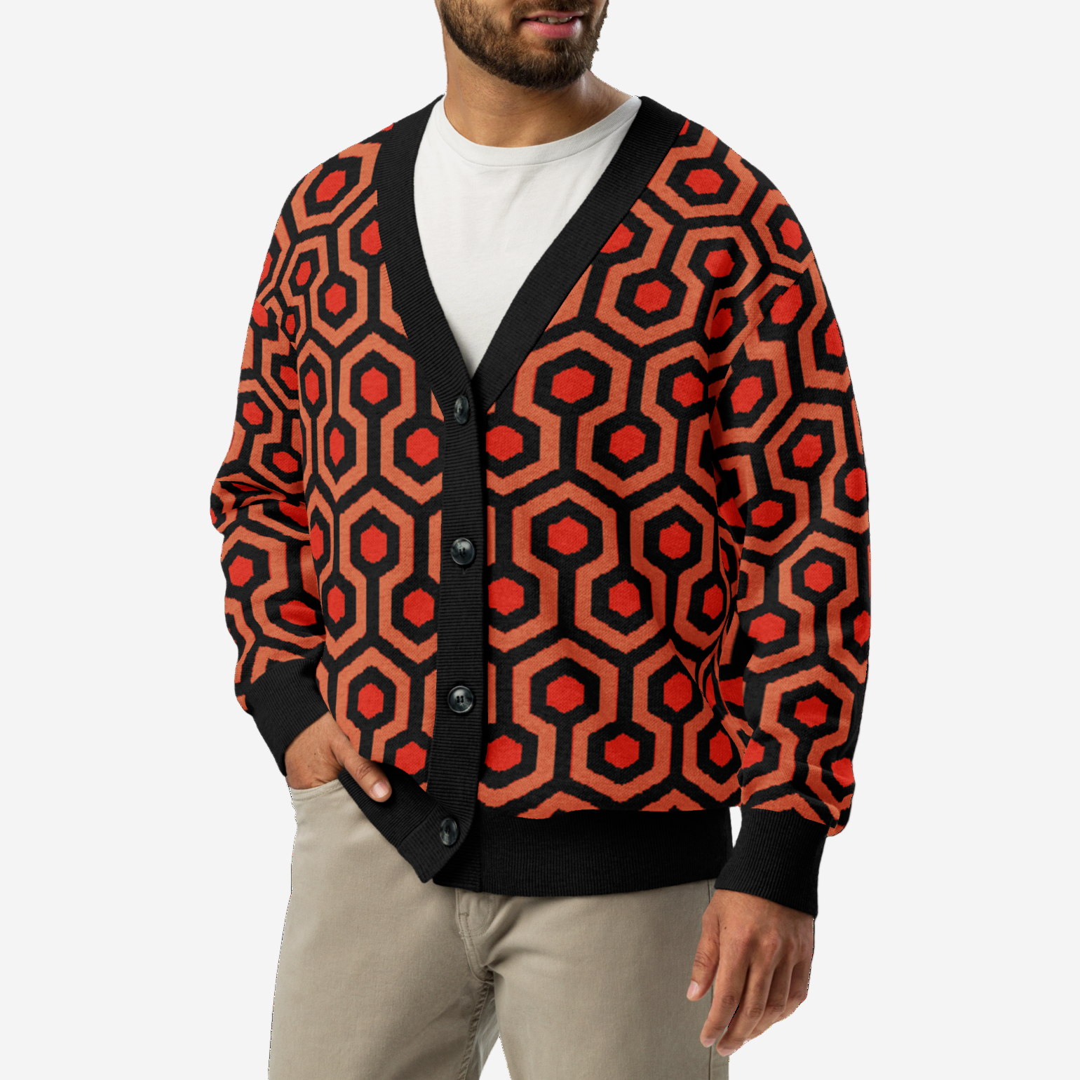 Man wearing a red and black patterned cardigan on a white background