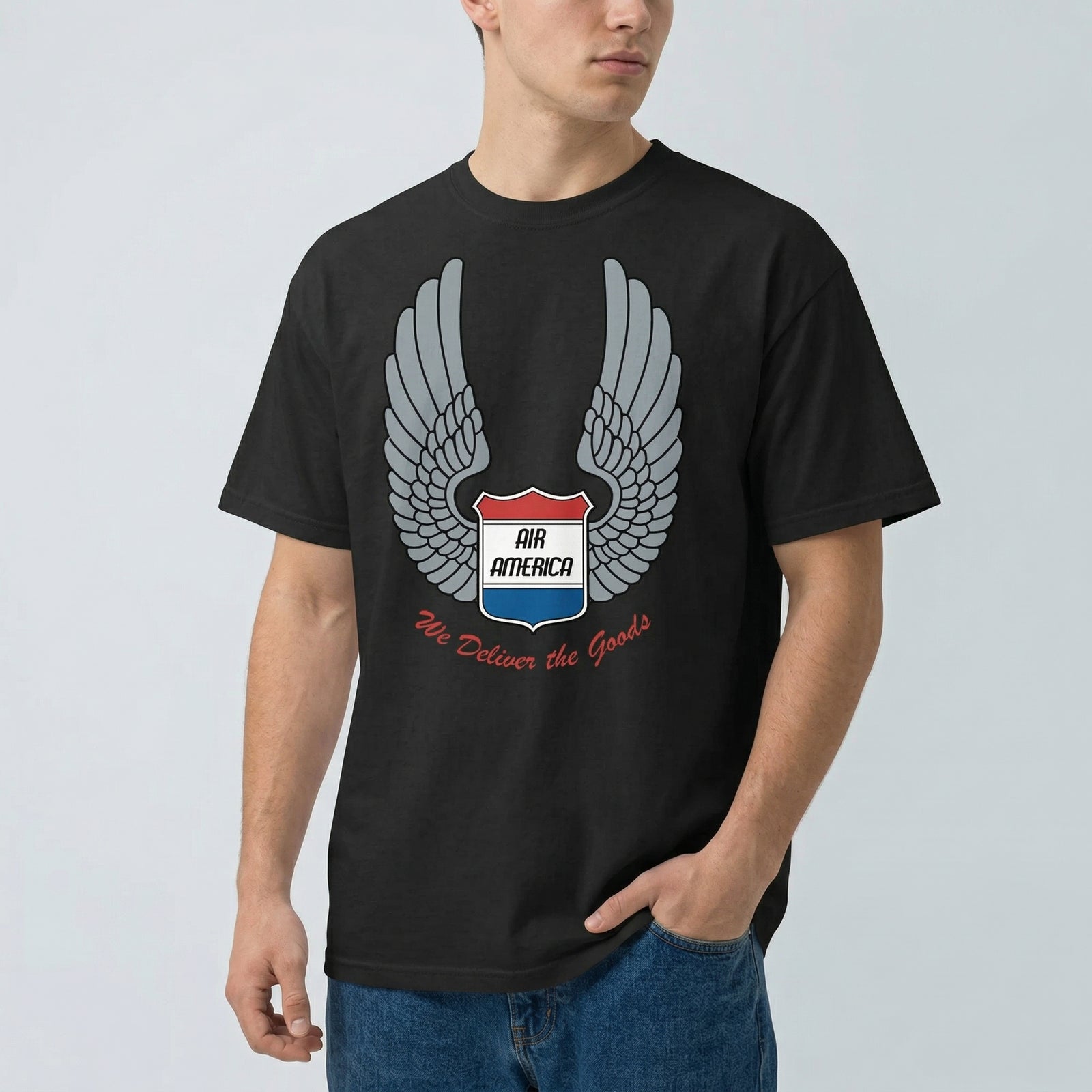 Person wearing a black t-shirt with Air America logo on a light gray background