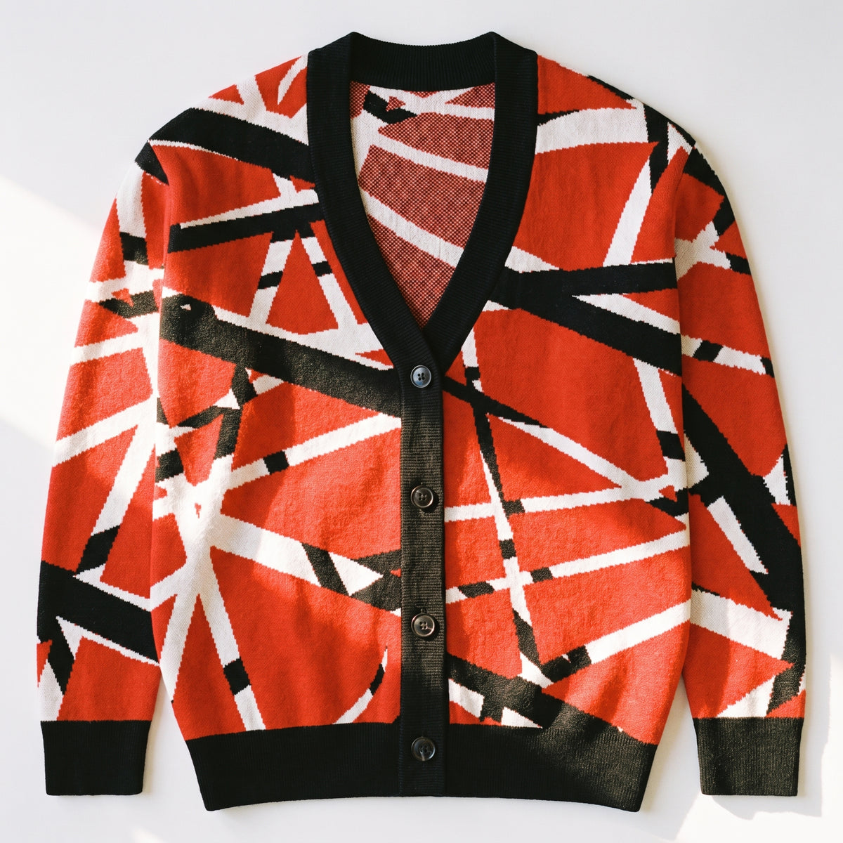 Frankenstripes red, black and white jacquard-knit cardigan, front flat lay with button closure