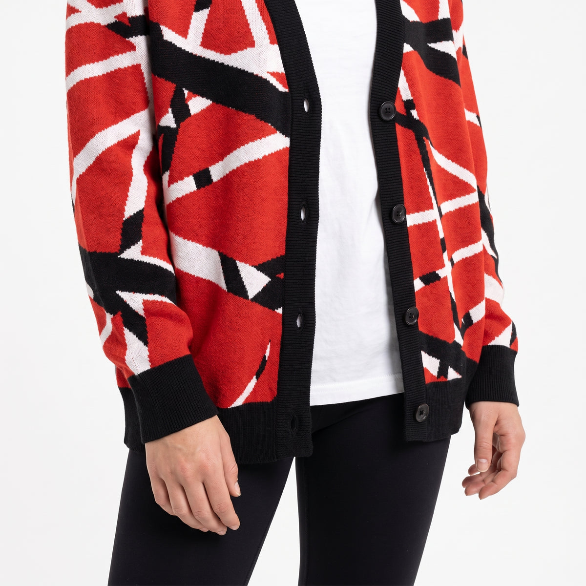 Woman wearing Frankenstripes red, black and white knitted cardigan, close-up studio view