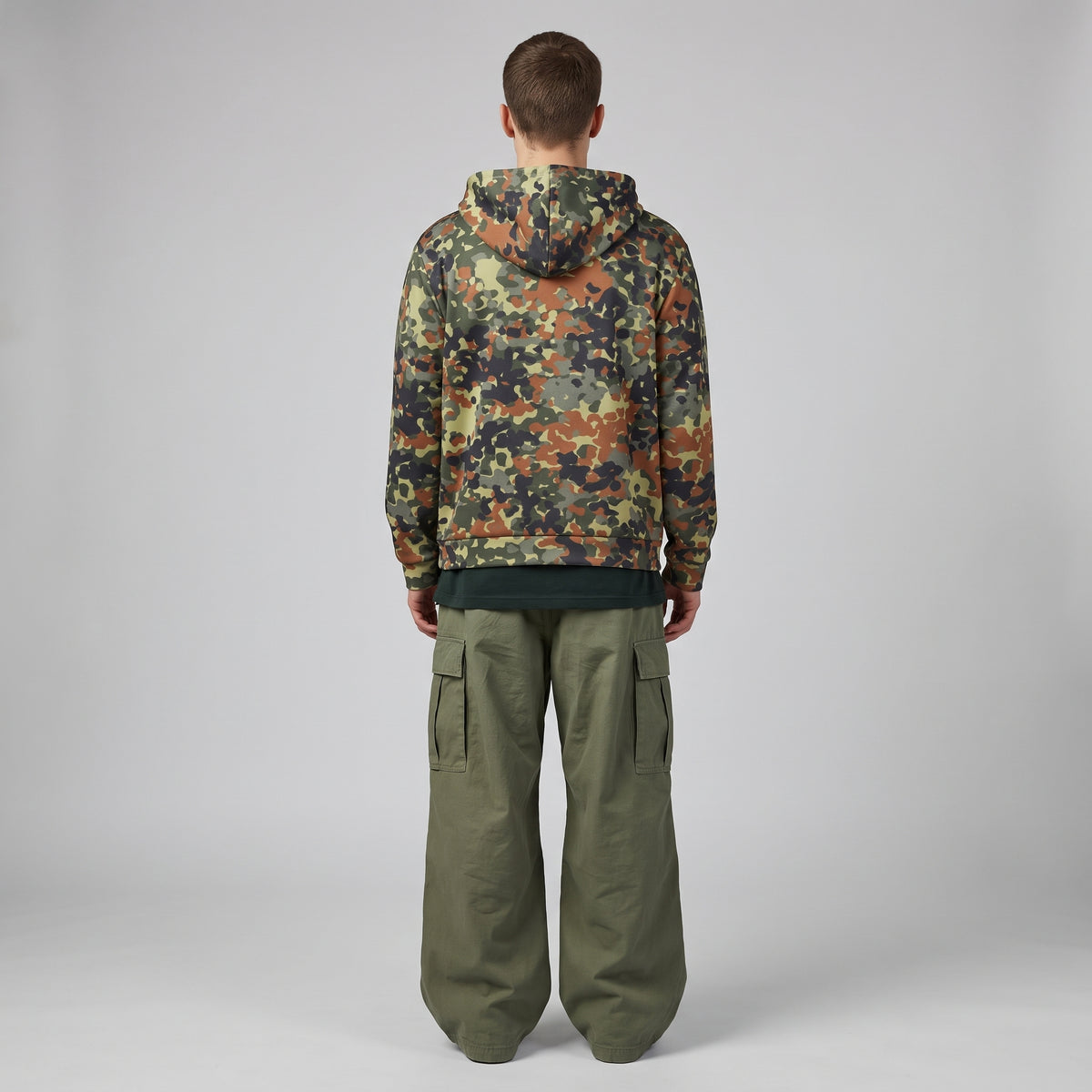 Man wearing the Flecktarn Reconnaissance camo zip hoodie, back view
