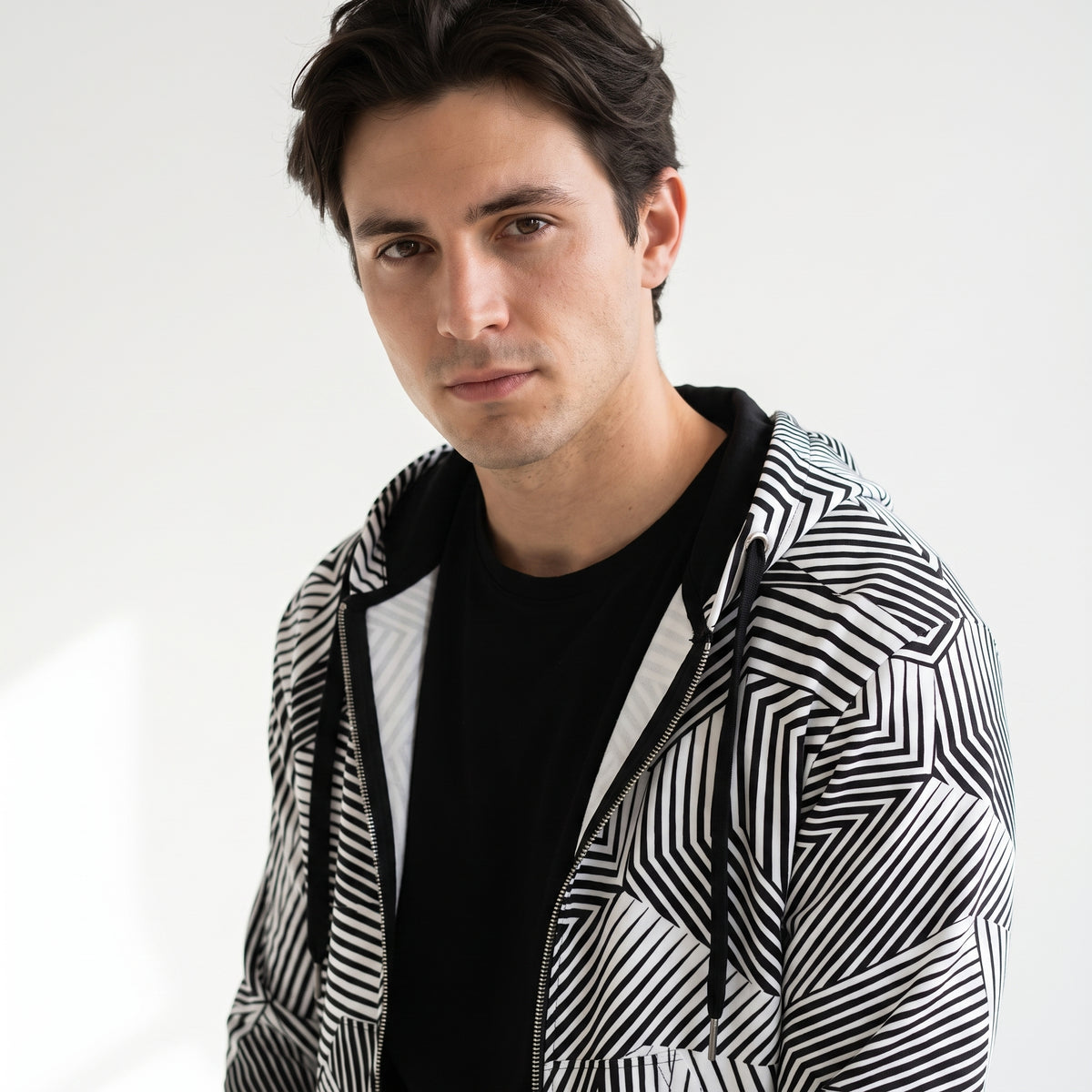 Man modeling the Dazzle naval camouflage zip hoodie