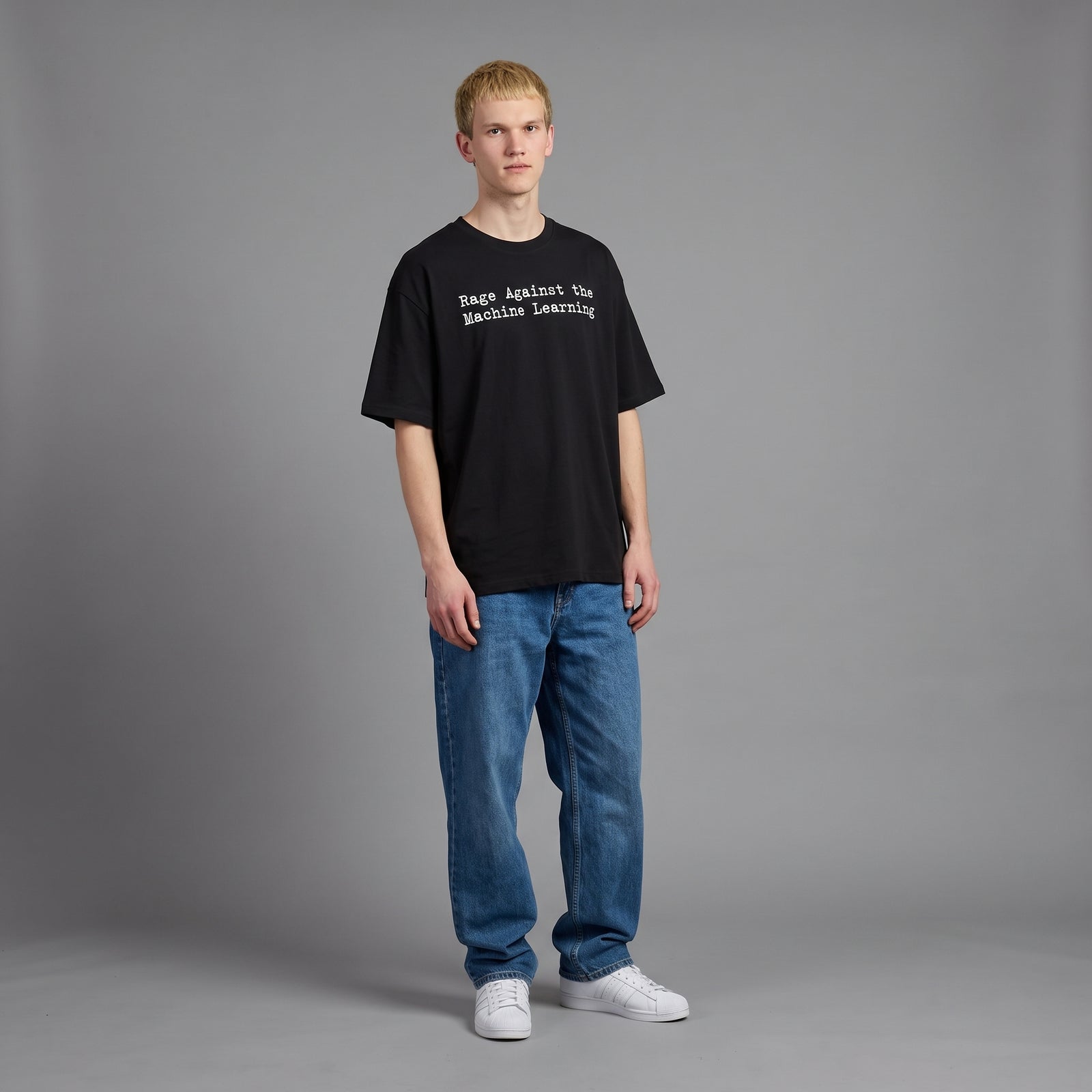 Full-length view of a man wearing the oversized black Machine Learning tee