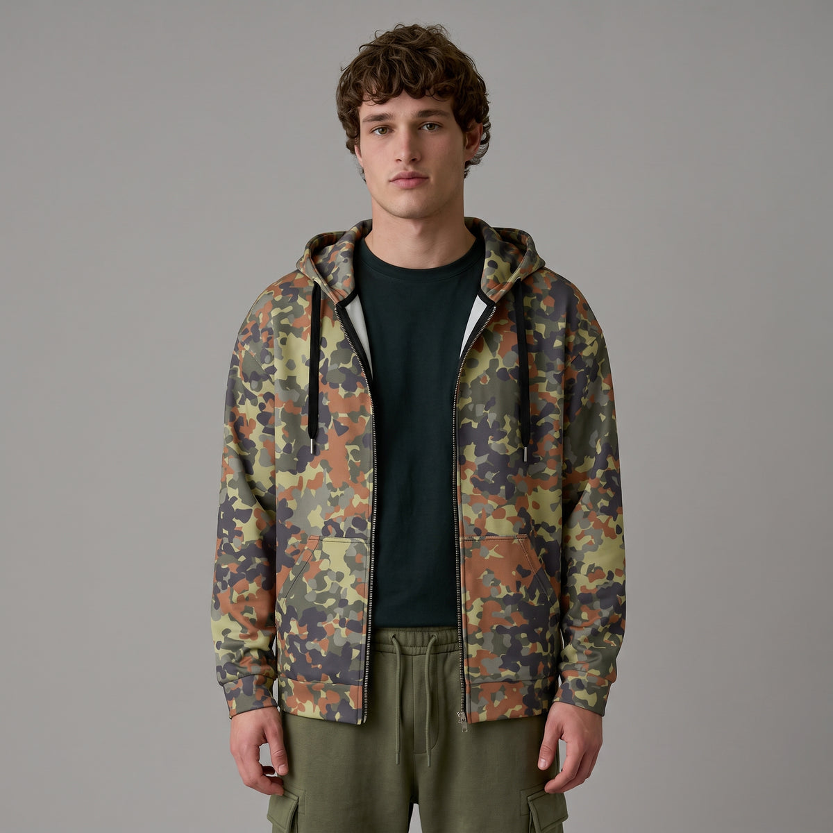 Man wearing the Flecktarn Reconnaissance camo zip hoodie, half-length front view