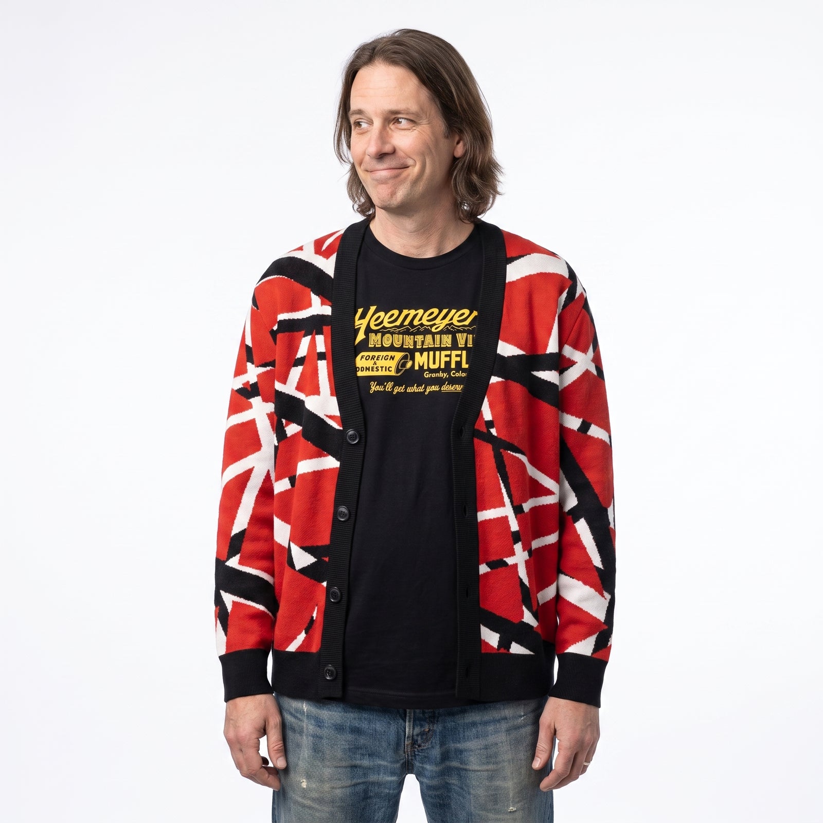 Man wearing Frankenstripes red, black and white knitted cardigan, half-length studio view