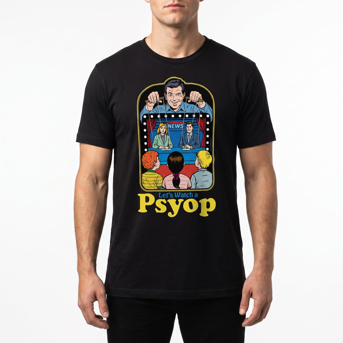 A man wearing a black short-sleeve t-shirt with a colorful retro graphic of a news broadcast and the text 'Let's Watch a Psyop' printed on the front, set against a plain white background.