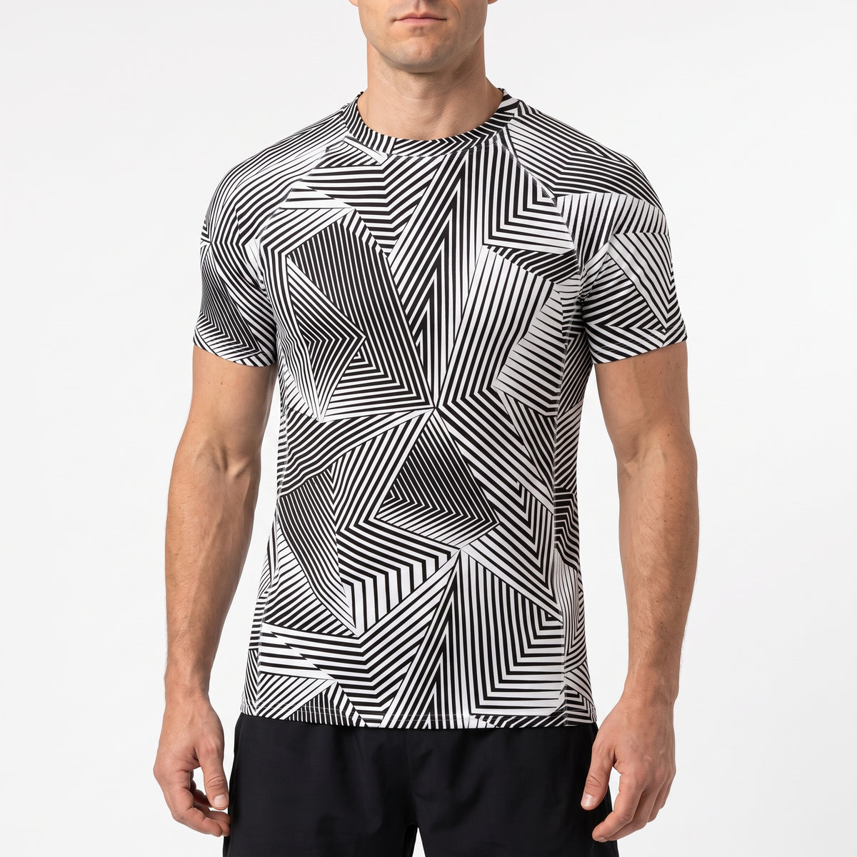 A man wearing a short-sleeve athletic t-shirt with a black and white geometric stripe pattern, paired with black shorts, against a plain white studio background.